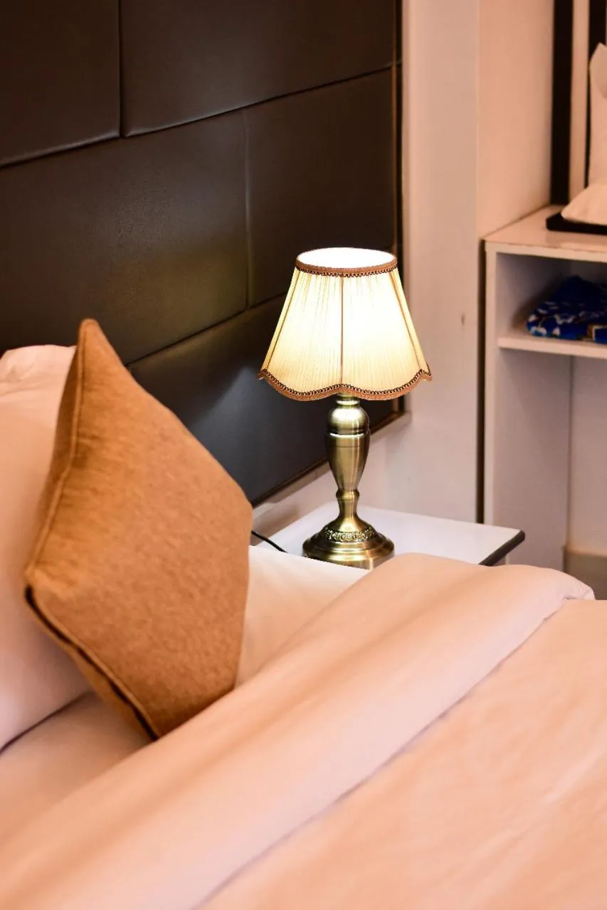 Bed in The Grand Mafi Hotel & Spa