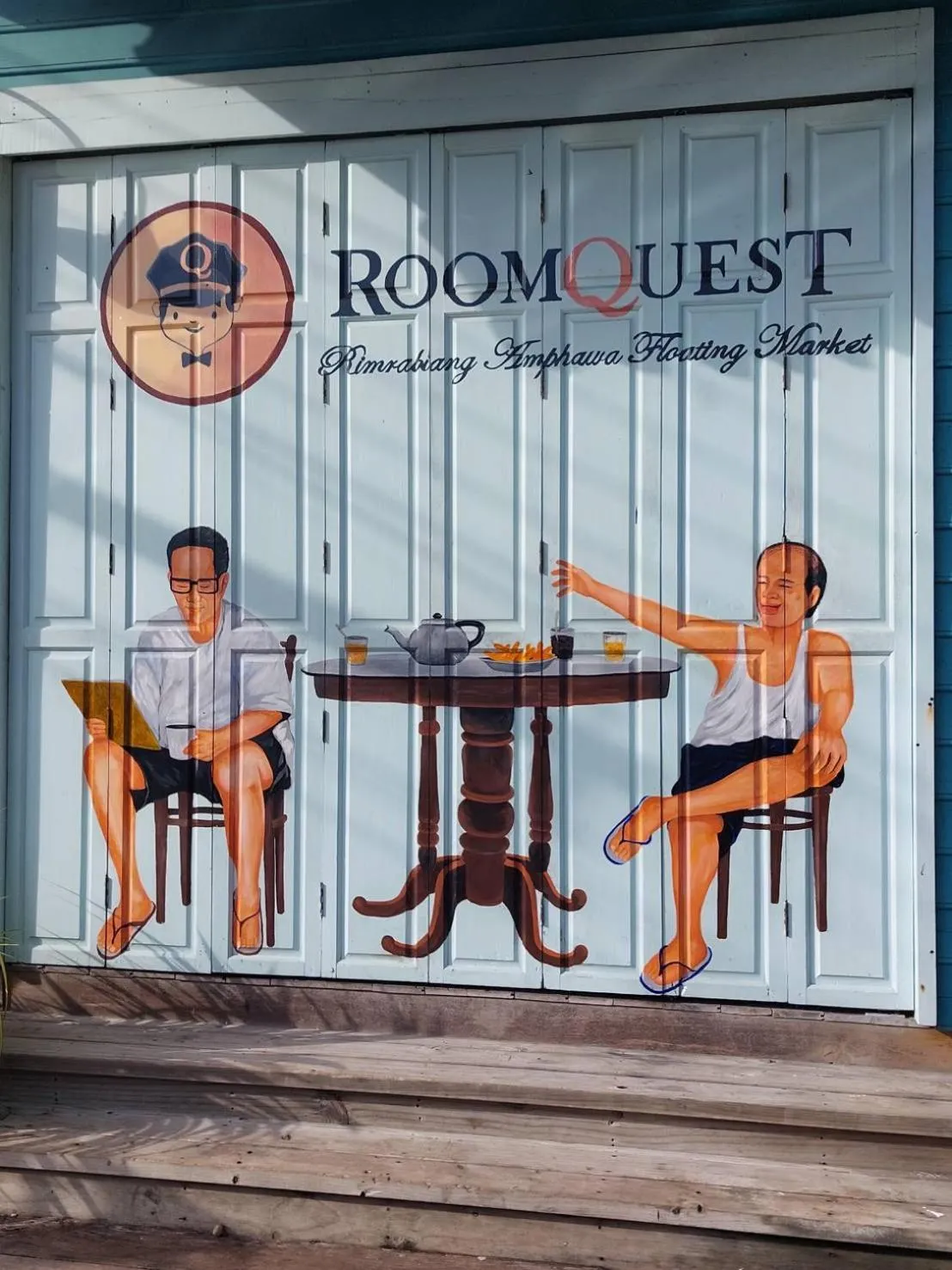 Property logo or sign in RoomQuest Rimrabeang at Amphawa