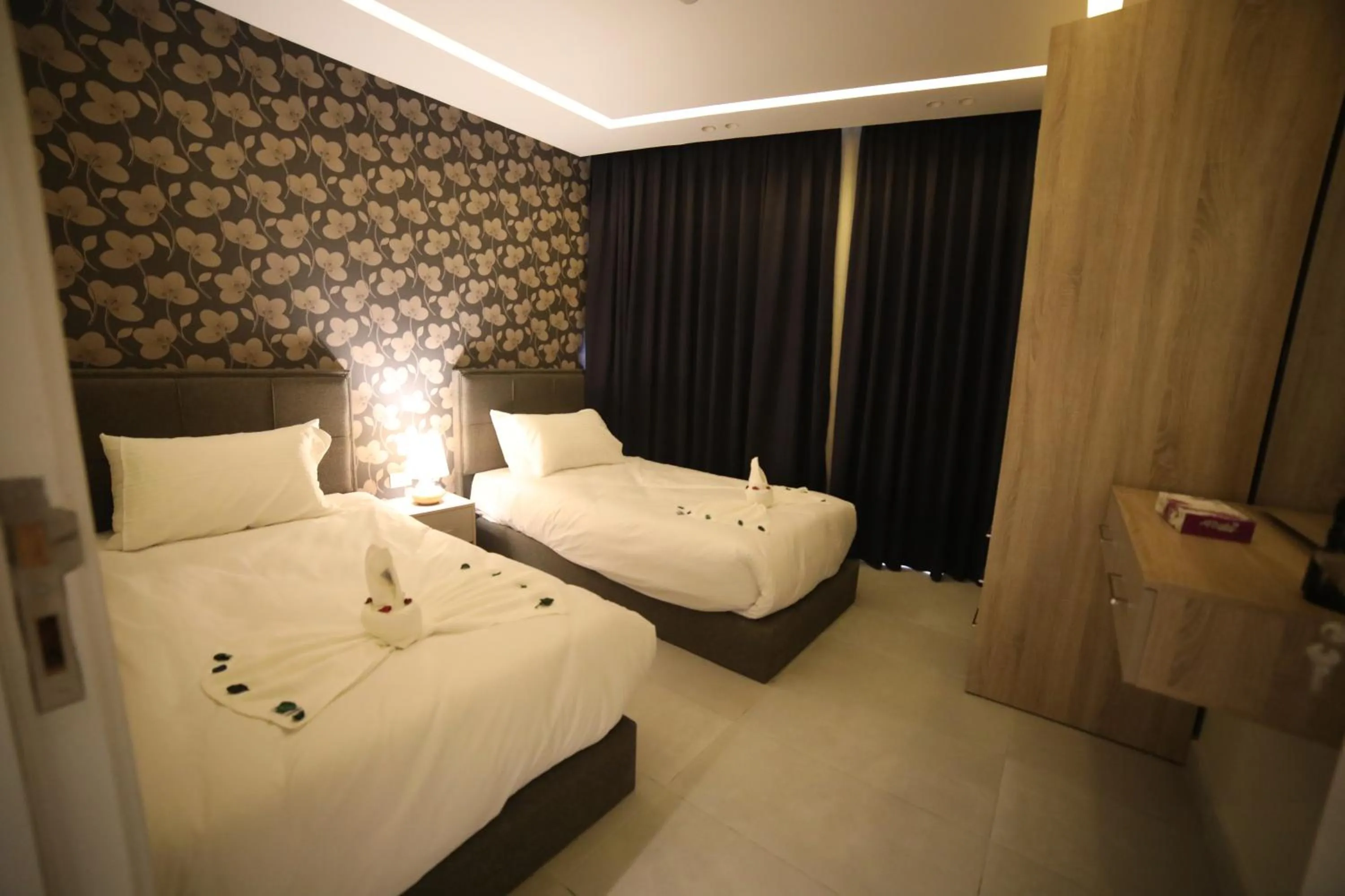 Bed in فندق صحارى الخليج Sahara Gulf Hotel Apartments