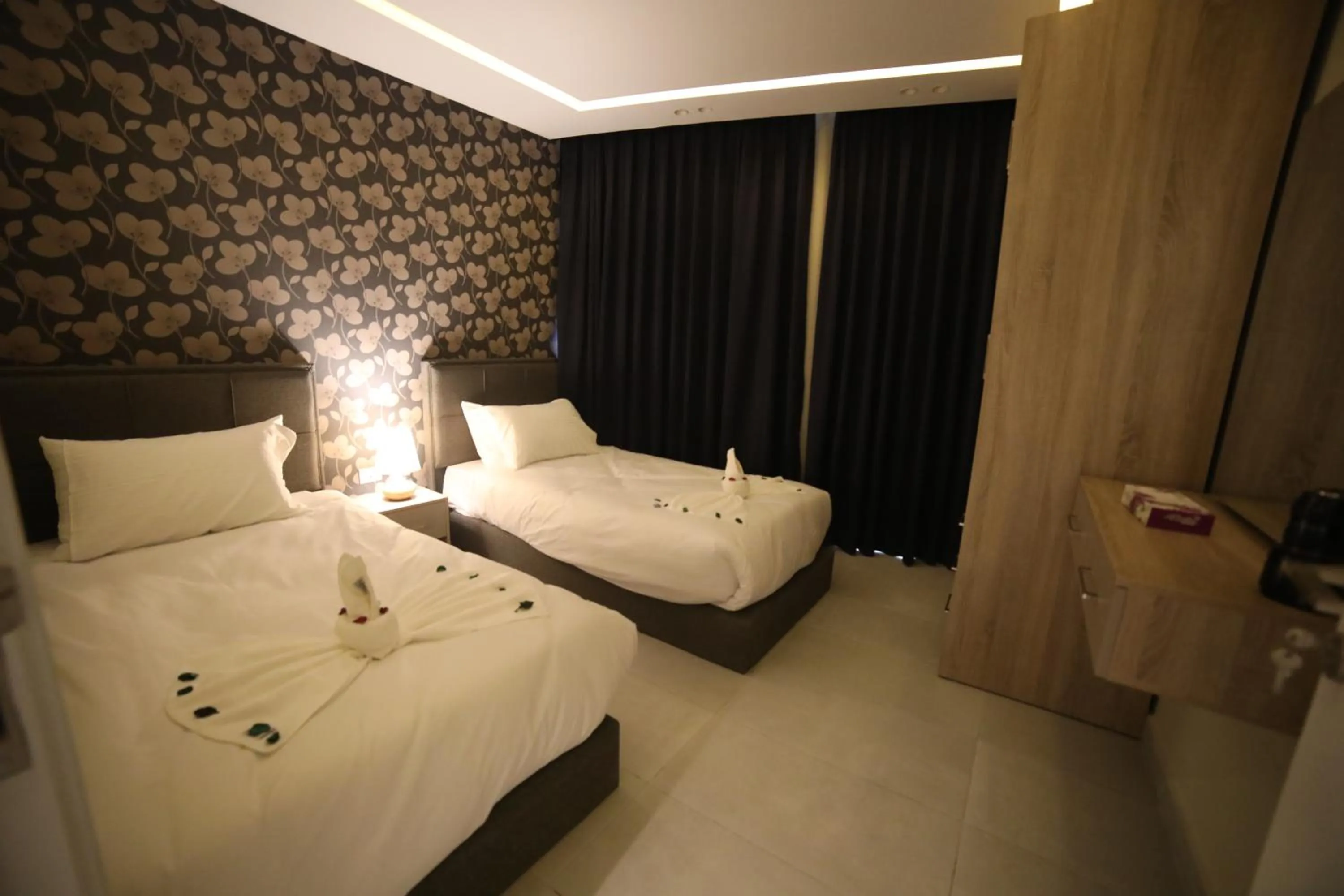 Bed in فندق صحارى الخليج Sahara Gulf Hotel Apartments