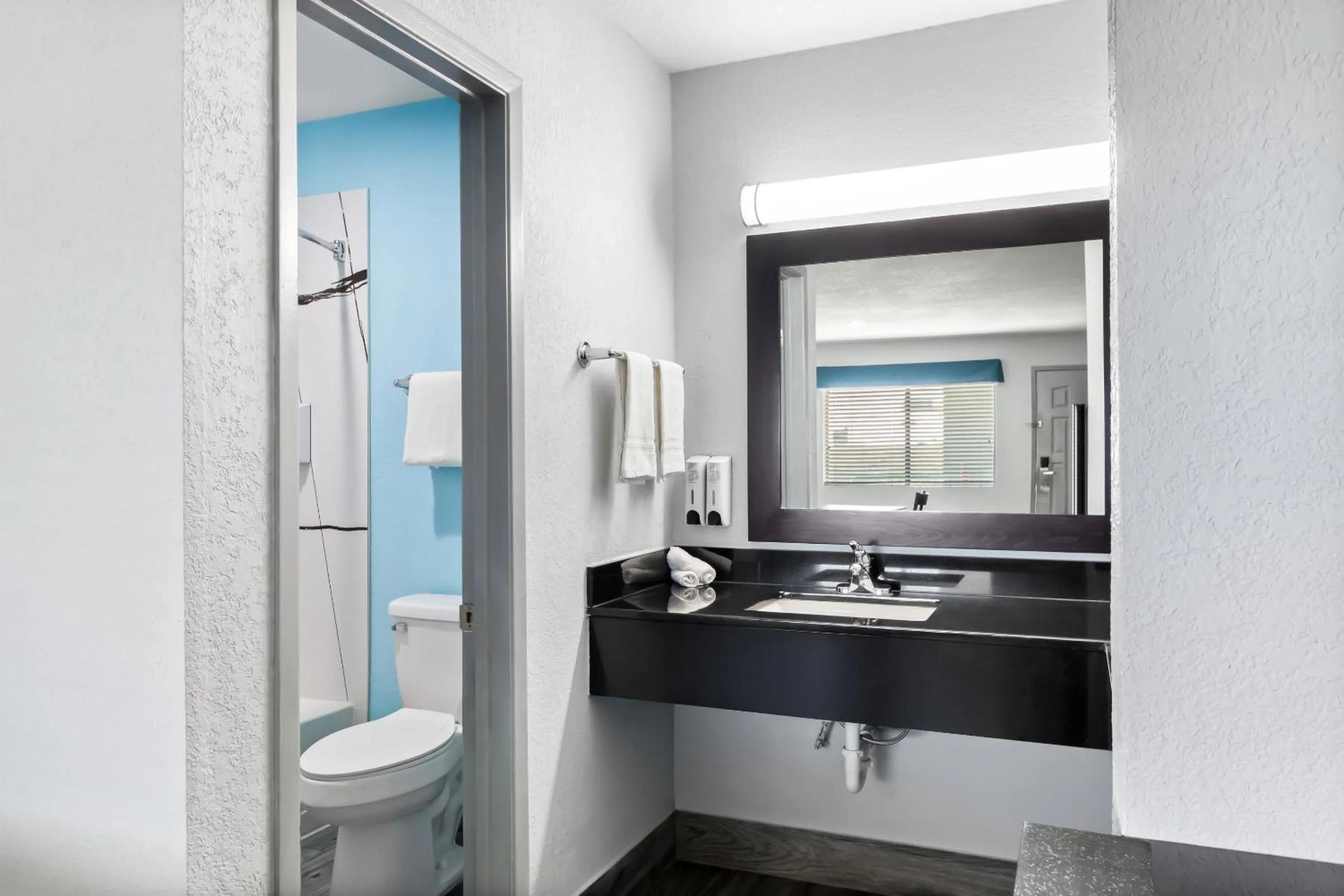 Bathroom in HomeTowne Studios by Red Roof San Antonio E - Frost Bank Center