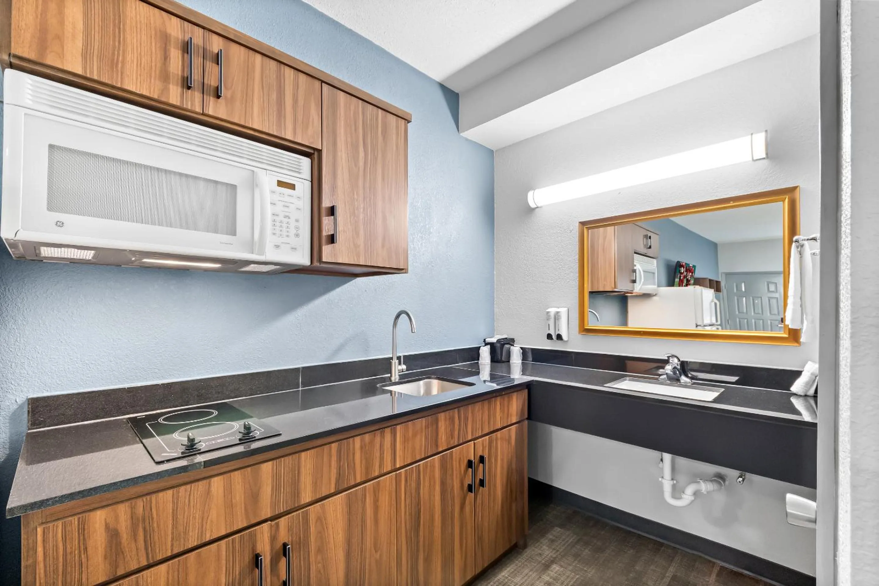 Photo of the whole room in HomeTowne Studios by Red Roof San Antonio E - Frost Bank Center