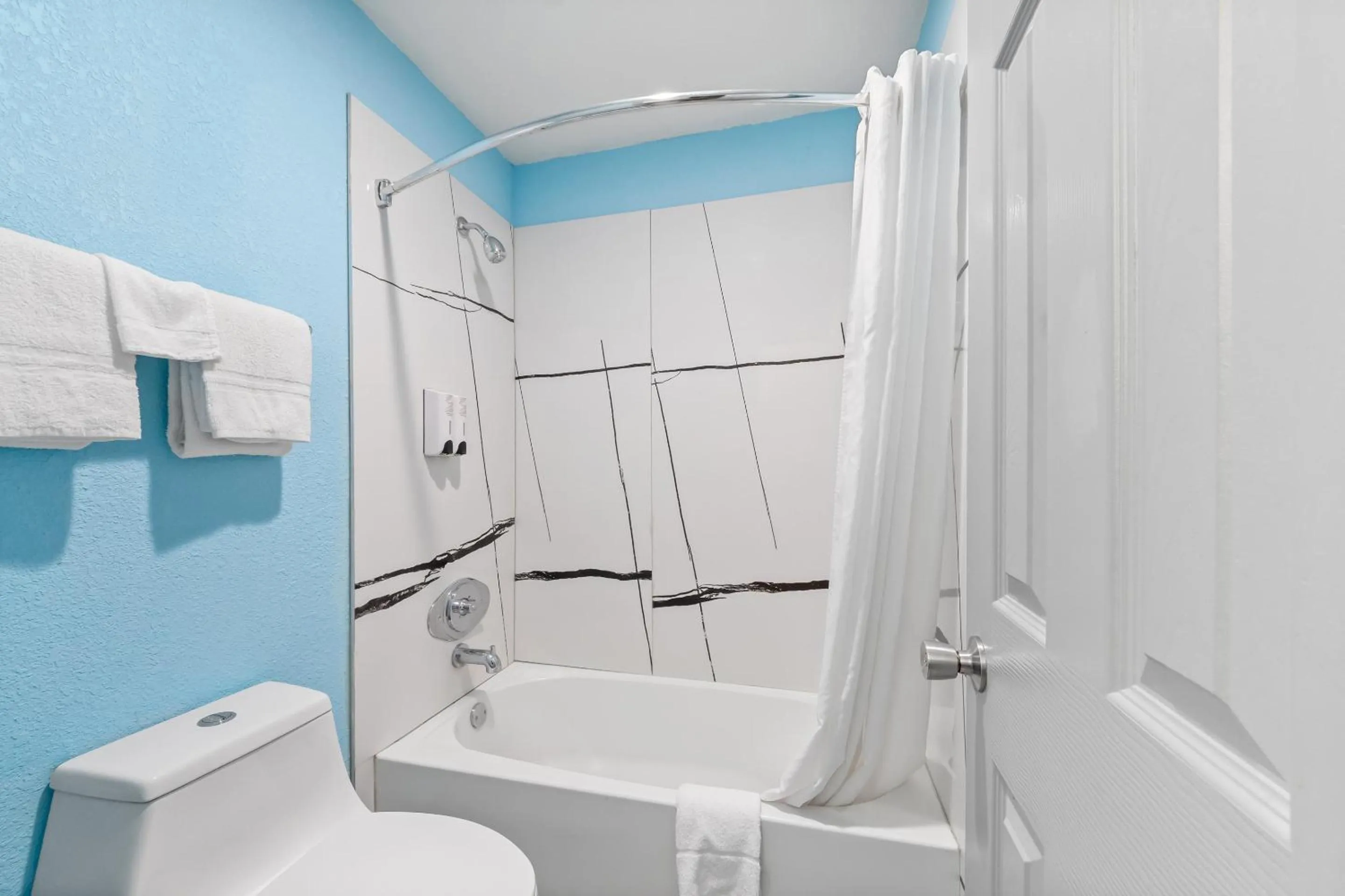 Bathroom in HomeTowne Studios by Red Roof San Antonio E - Frost Bank Center