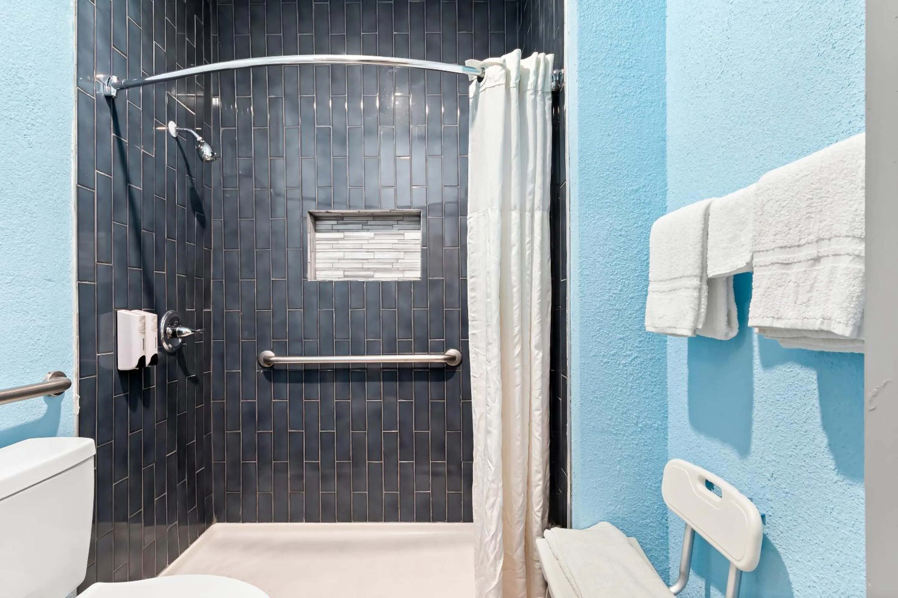 Bathroom in HomeTowne Studios by Red Roof San Antonio E - Frost Bank Center