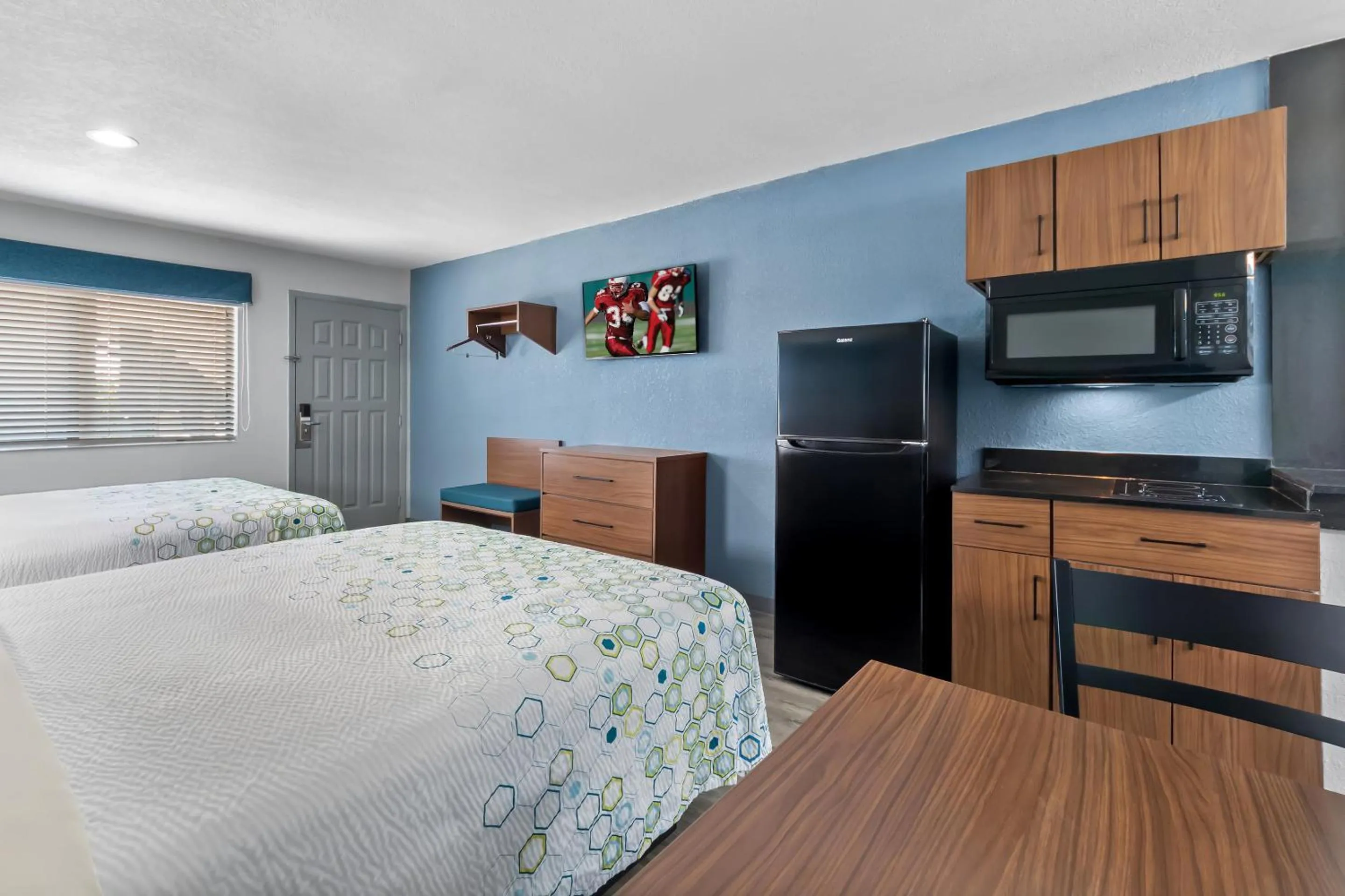 Photo of the whole room, Bed in HomeTowne Studios by Red Roof San Antonio E - Frost Bank Center