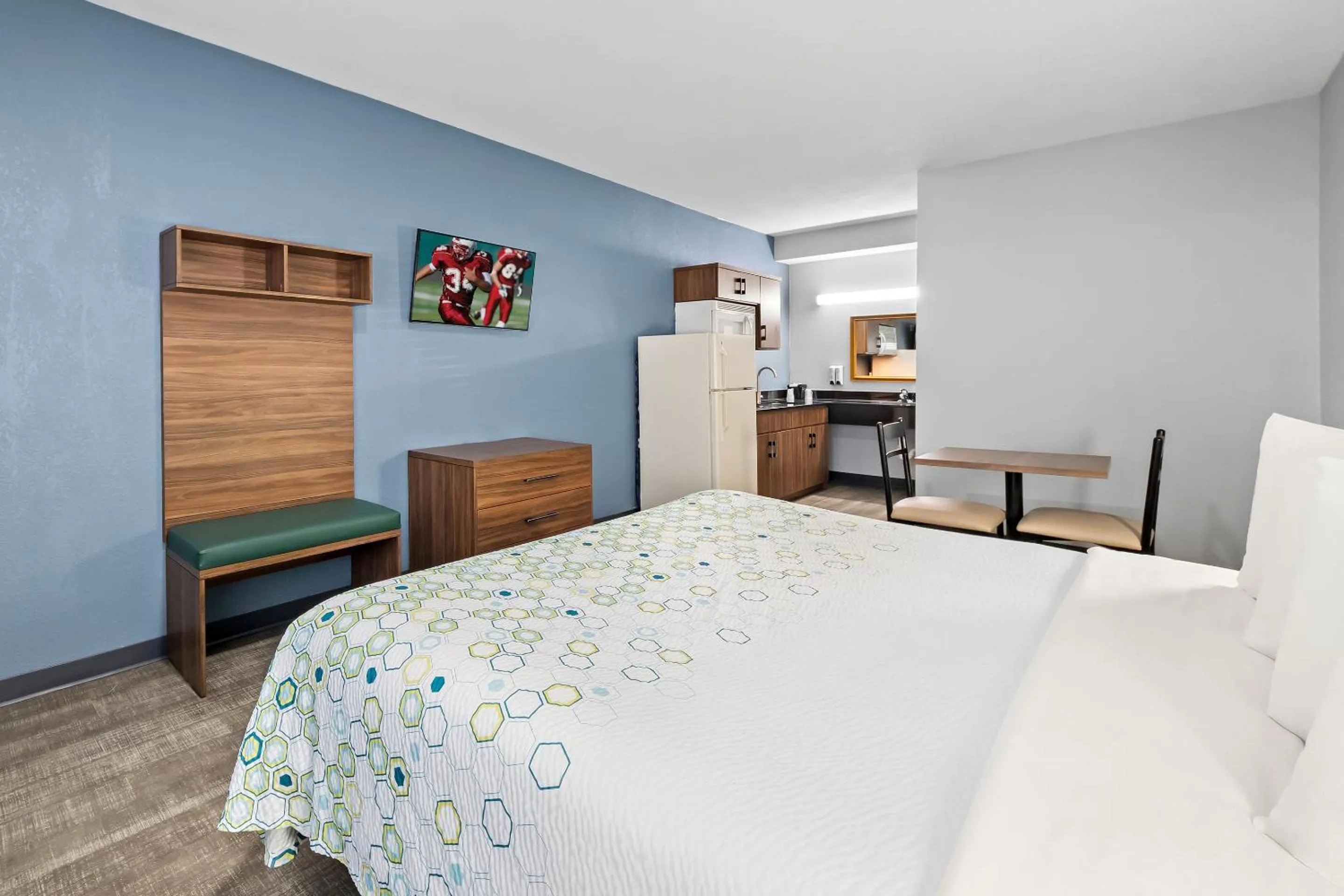 Photo of the whole room, Bed in HomeTowne Studios by Red Roof San Antonio E - Frost Bank Center