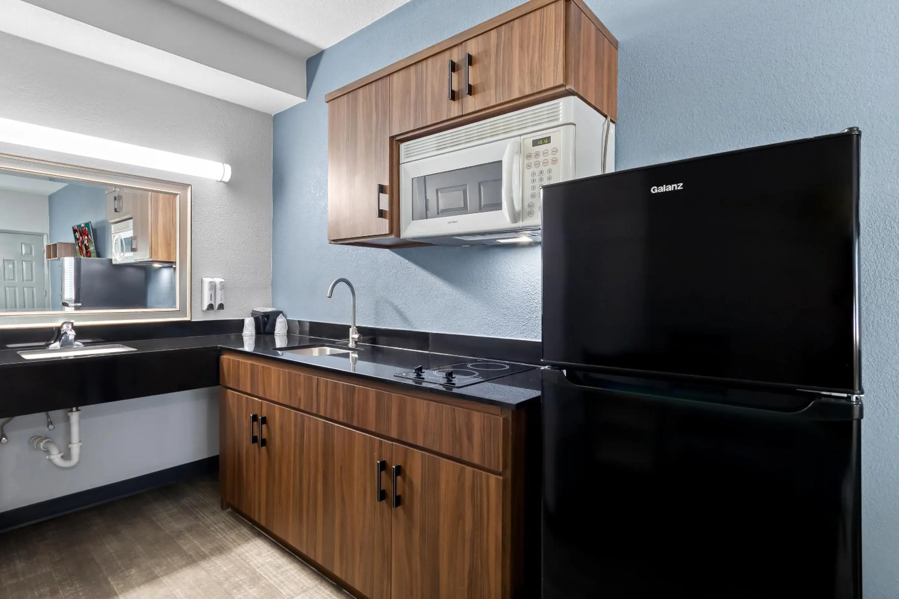 Photo of the whole room in HomeTowne Studios by Red Roof San Antonio E - Frost Bank Center