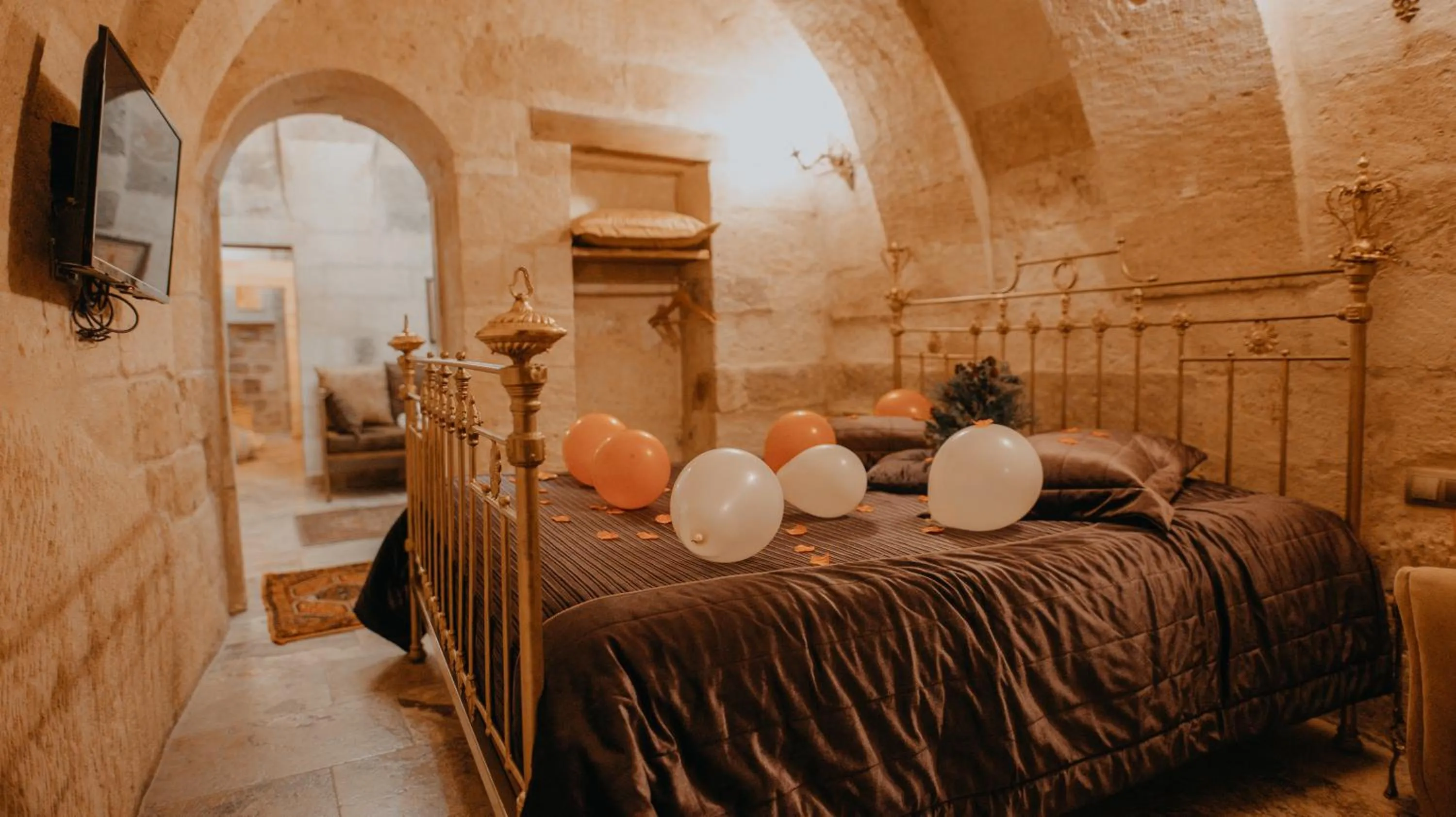 Bed in Serenus Cave Suites