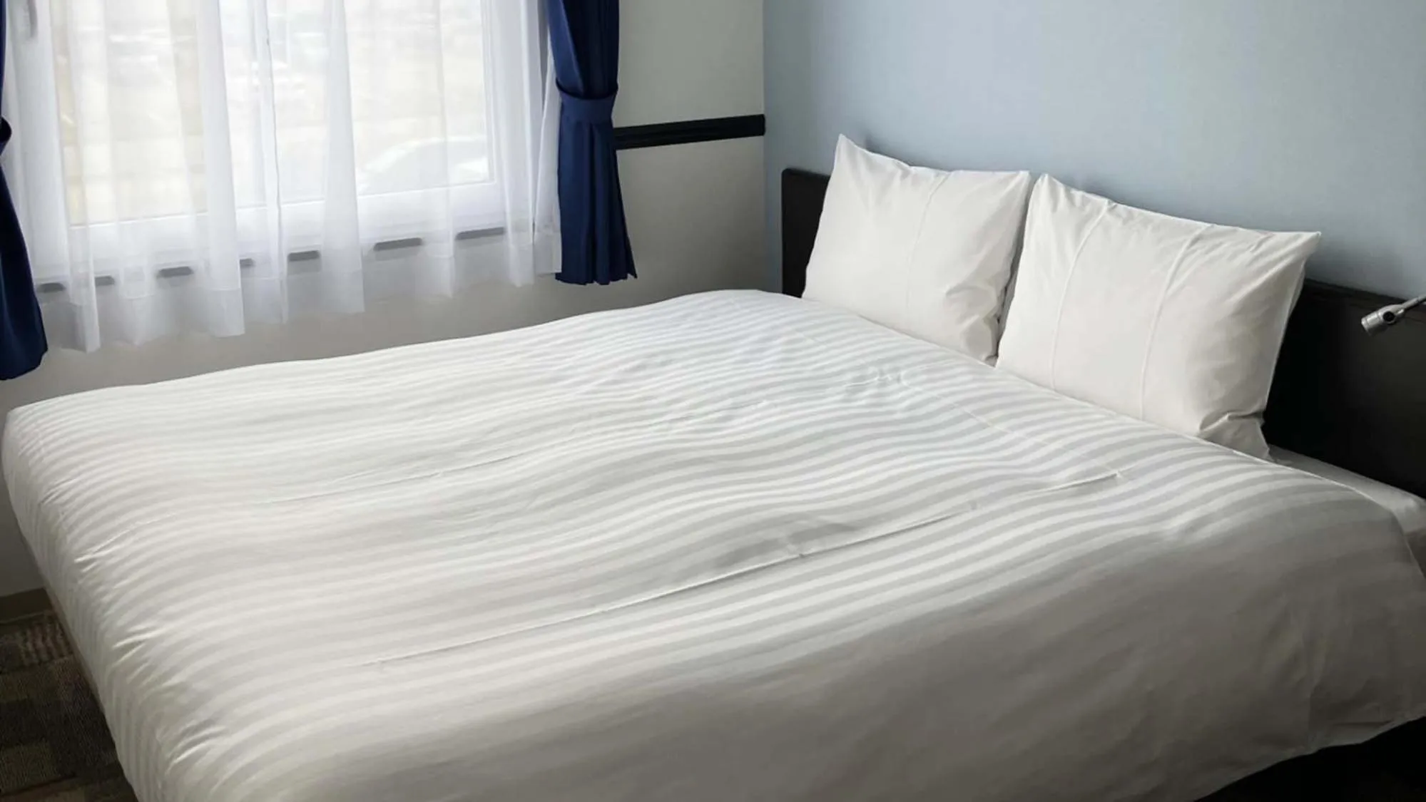 Bedroom, Bed in Toyoko Inn Shin takaoka eki Shinkansen Minami guchi