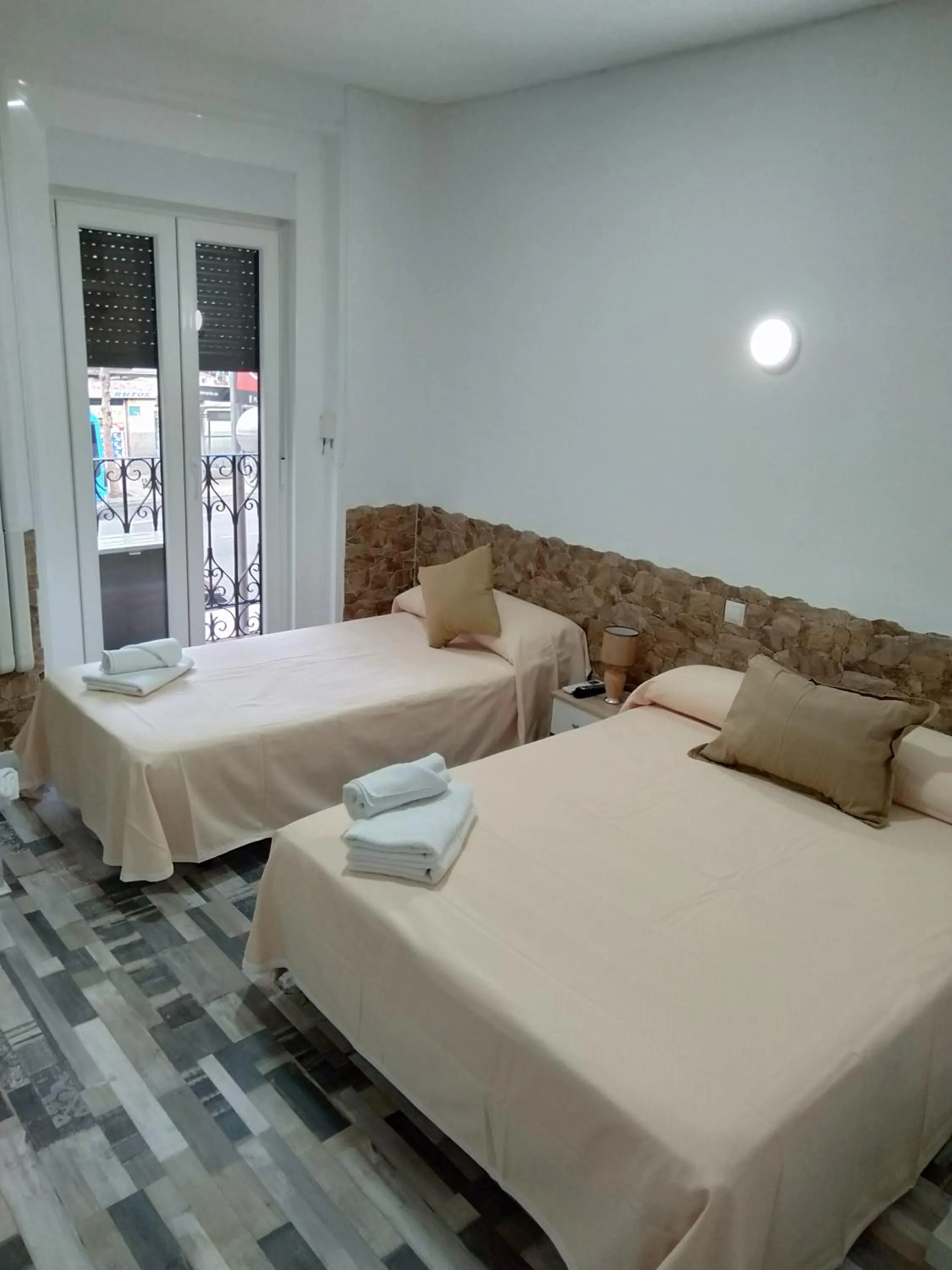 Bed in HOSTAL Noche y Dia