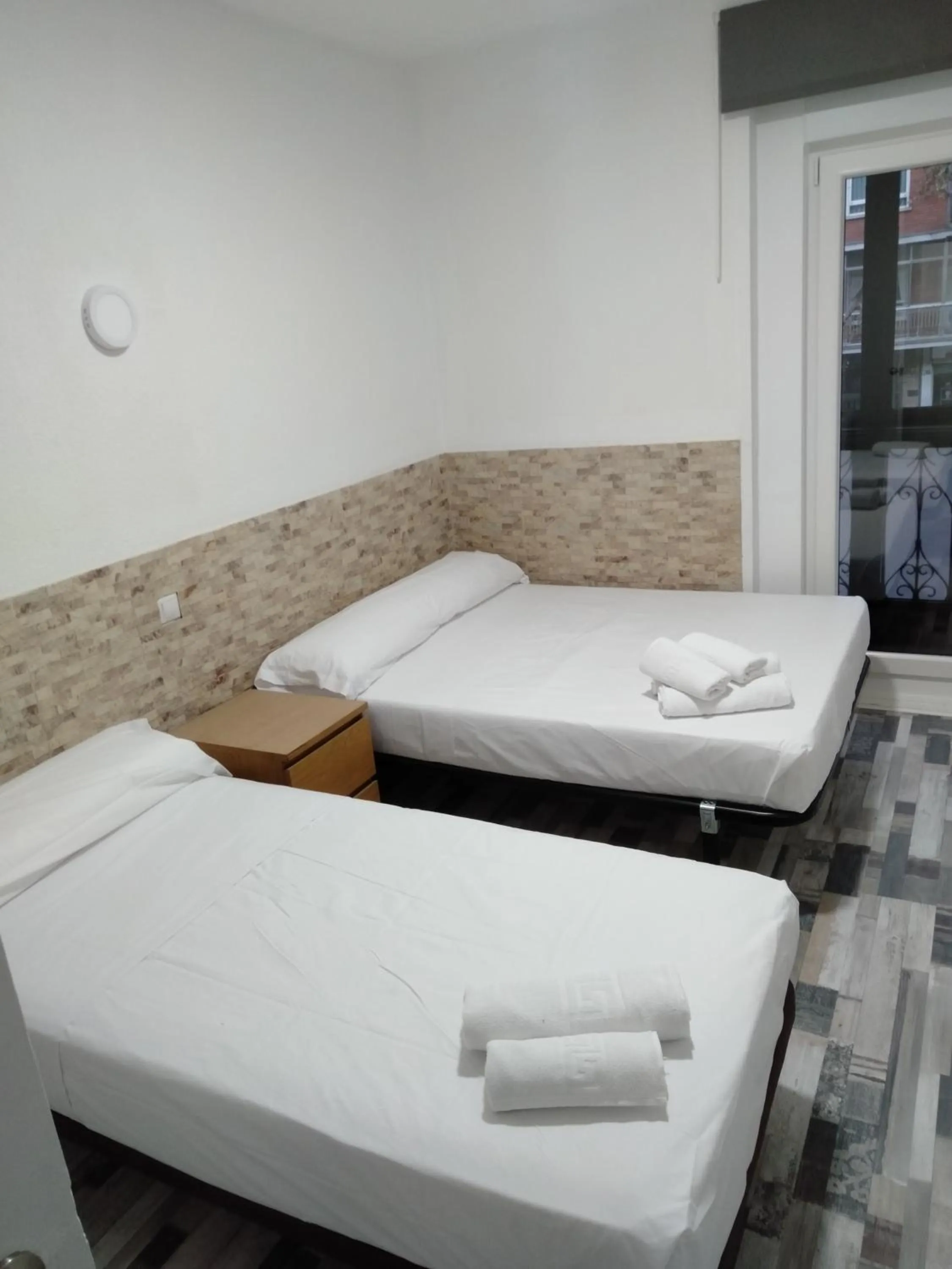 Bed in HOSTAL Noche y Dia