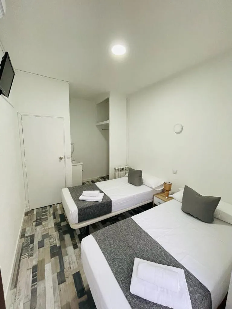 Bed in HOSTAL Noche y Dia