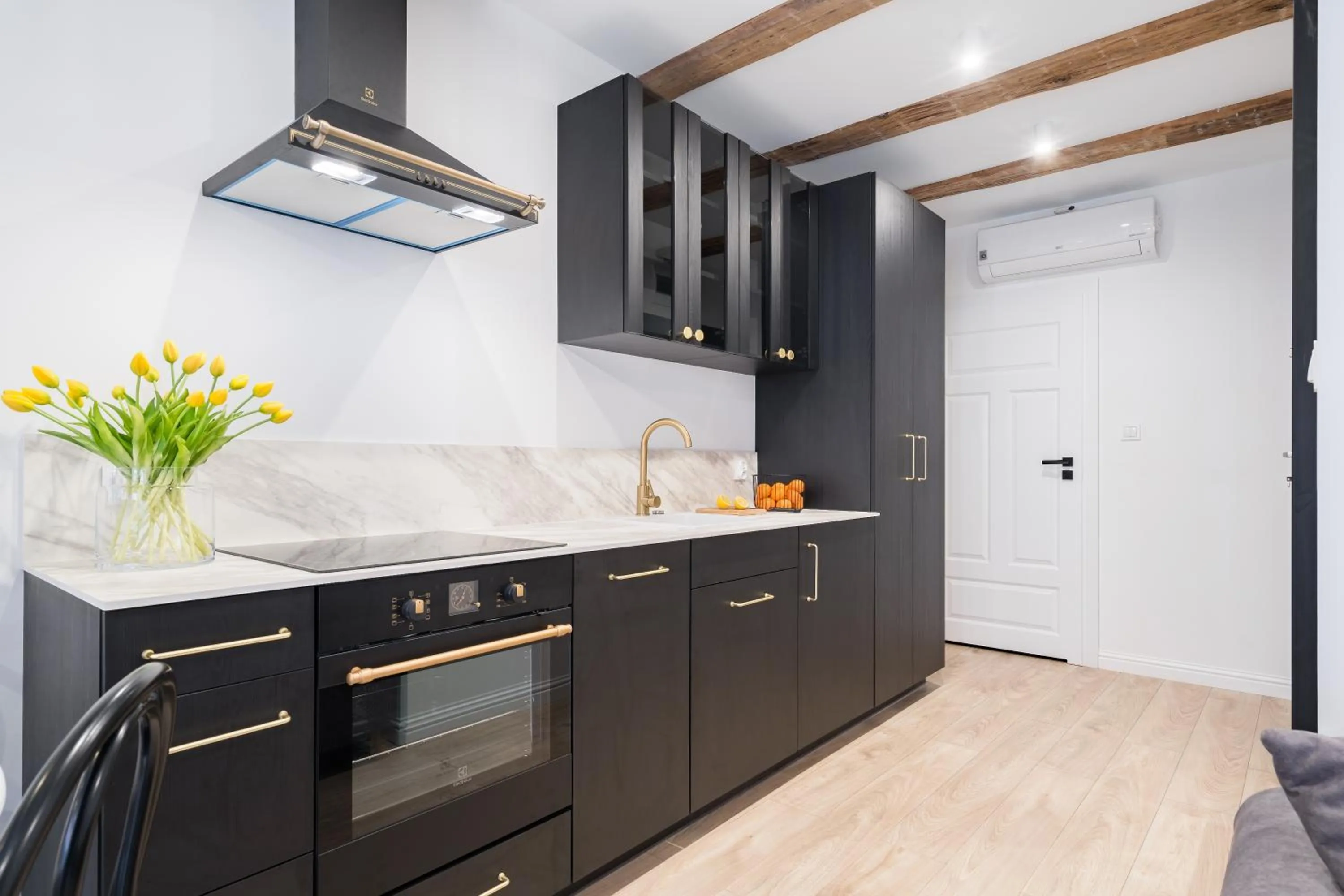 kitchen in Miodowa Faktoria #7 by Rentoom