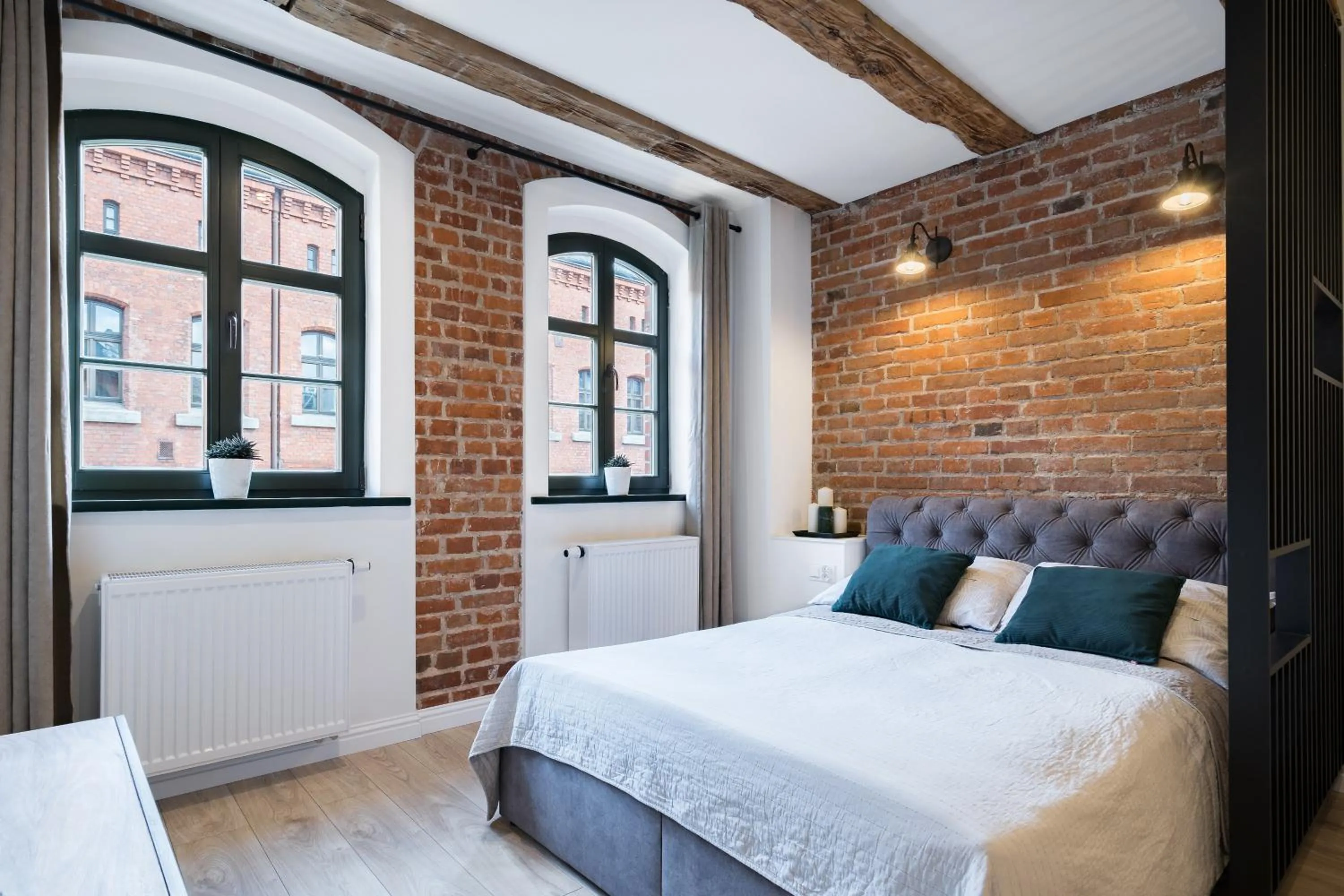 Bedroom, Bed in Miodowa Faktoria #7 by Rentoom