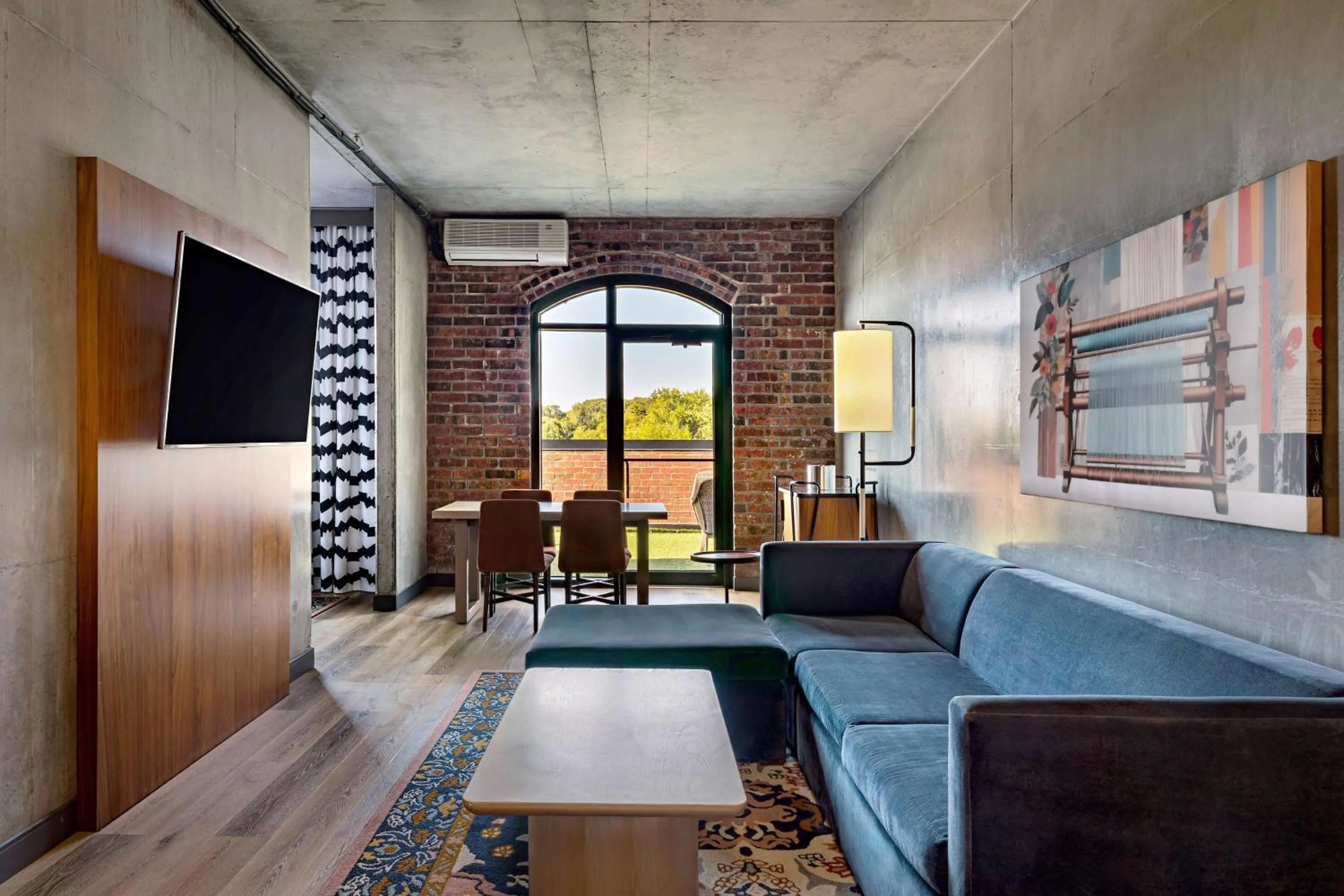 Living room, Bed in The LOOM Hotel, Tapestry Collection by Hilton