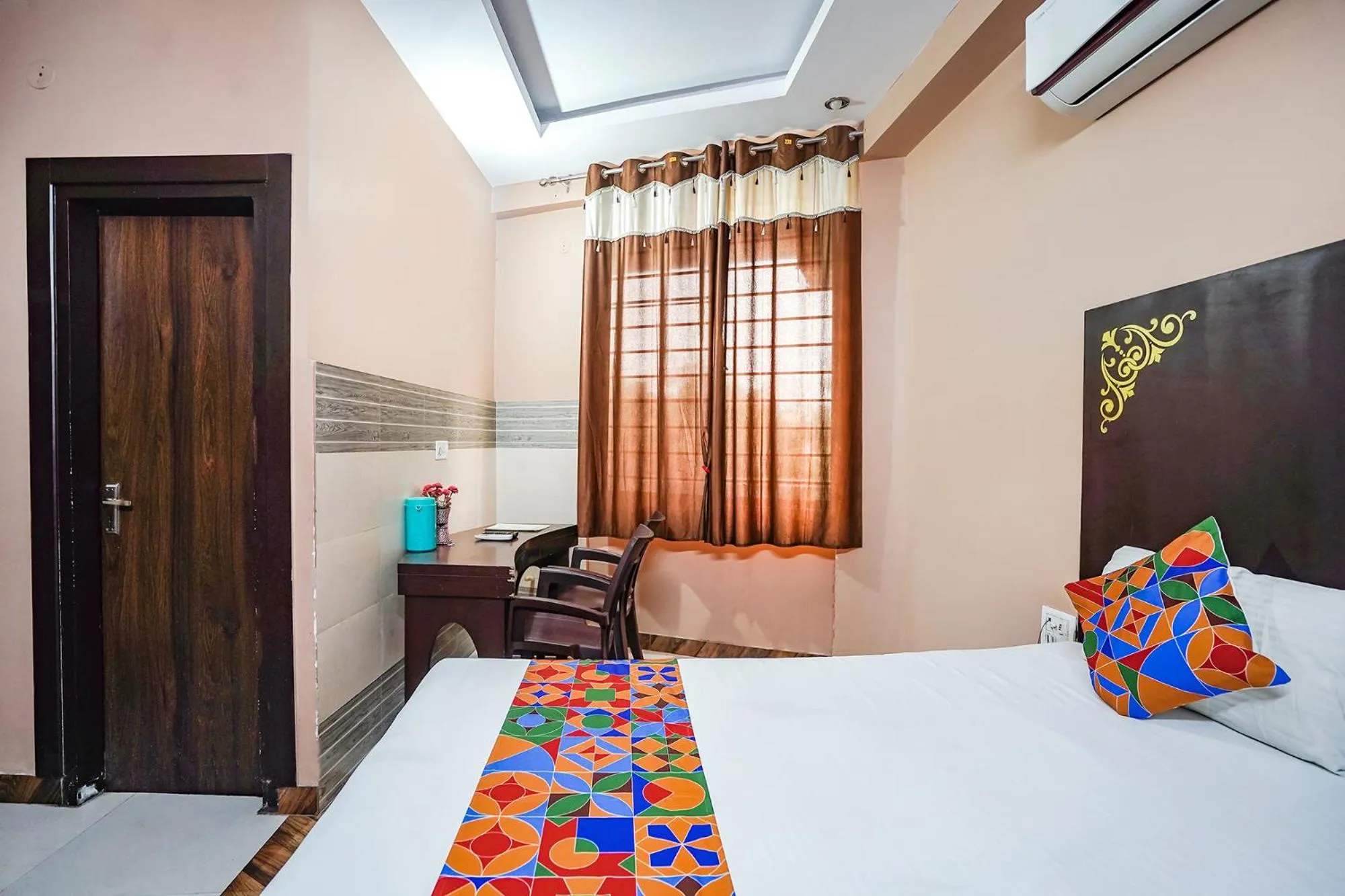 Bed in FabHotel Krishna Heights