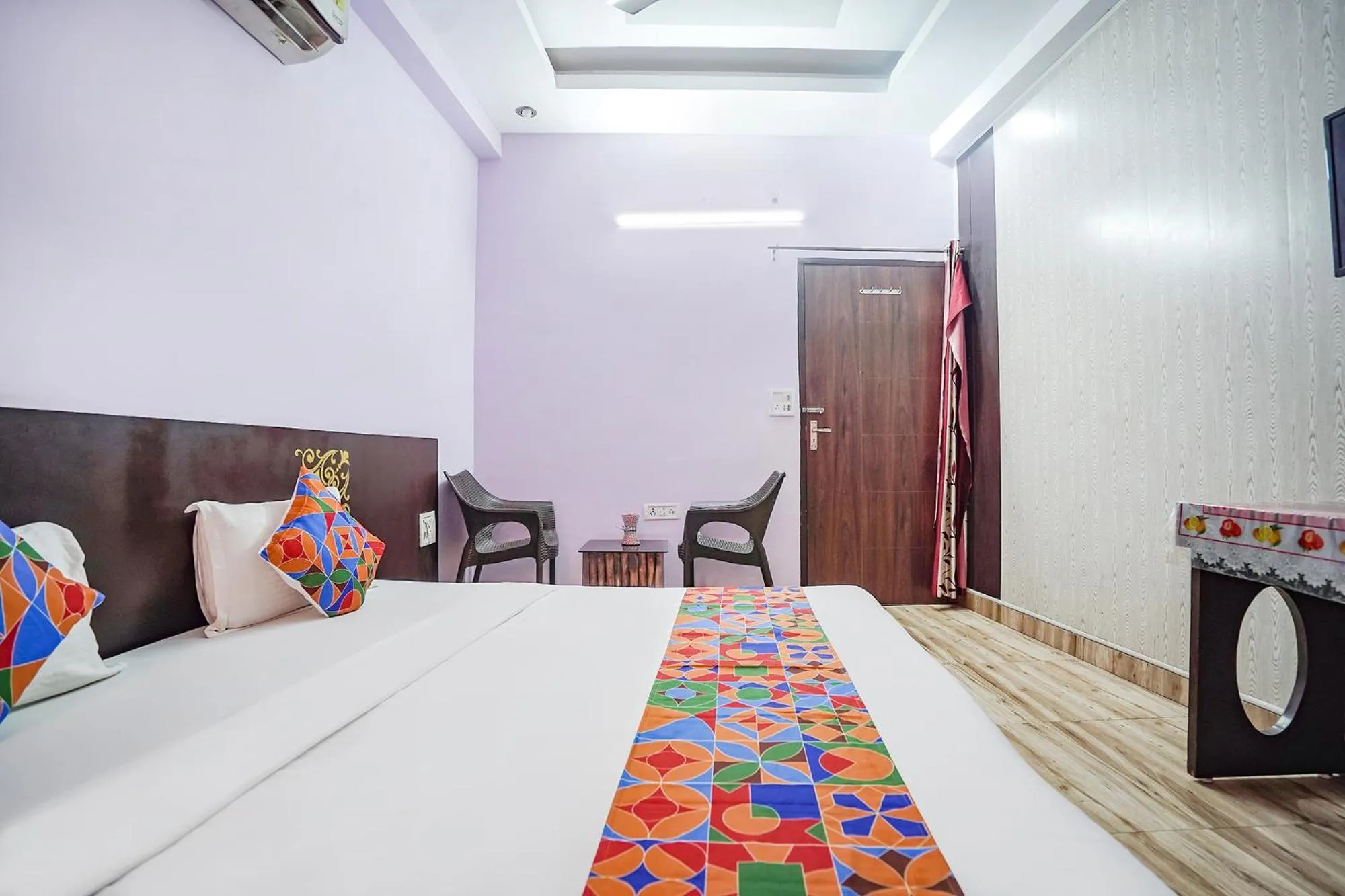 Bed in FabHotel Krishna Heights