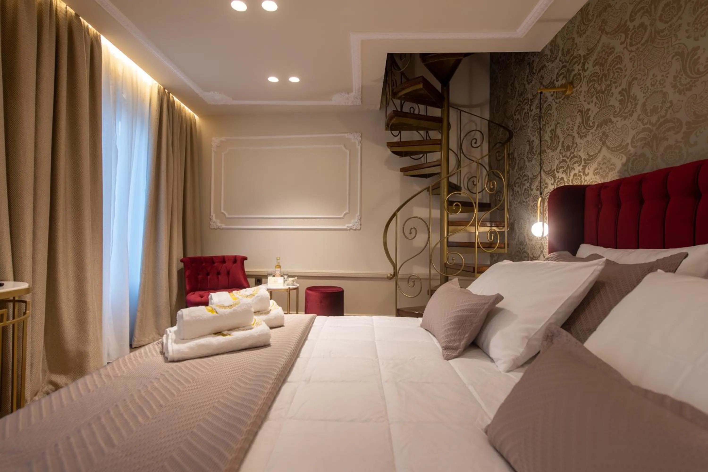 Bed in Capolavoro Suites