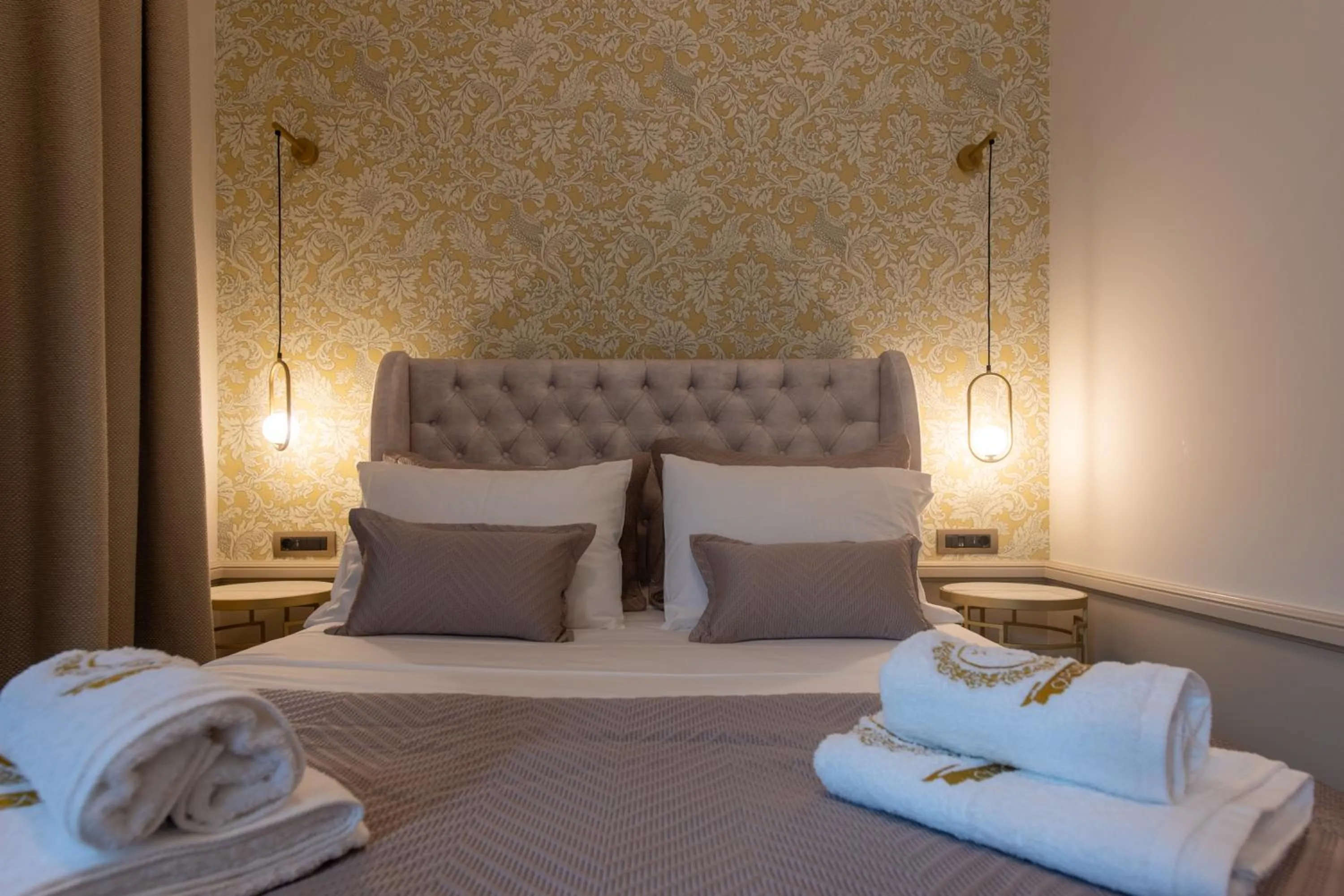 Bed in Capolavoro Suites