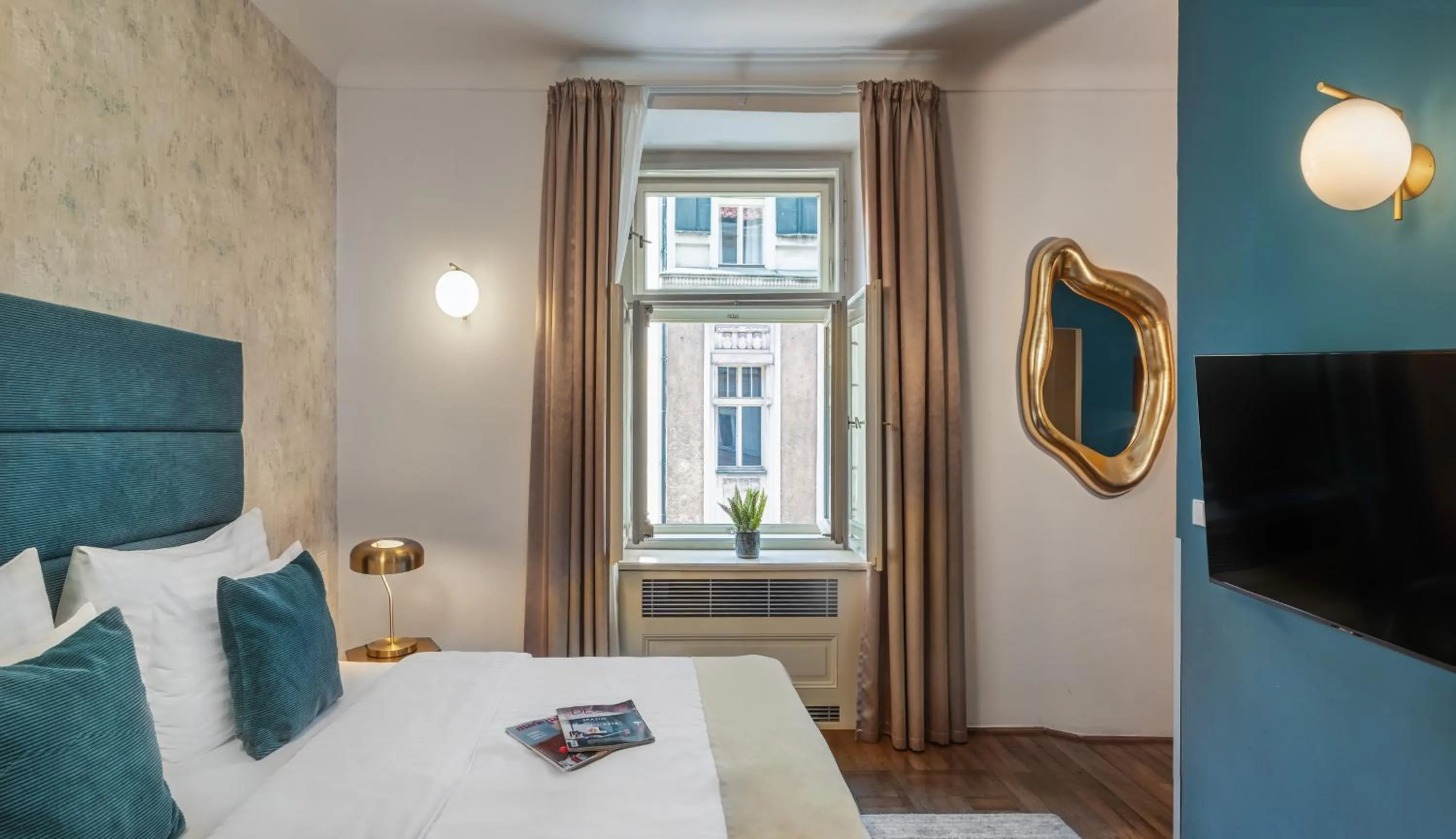 Bed in Golden Angel Suites by Adrez