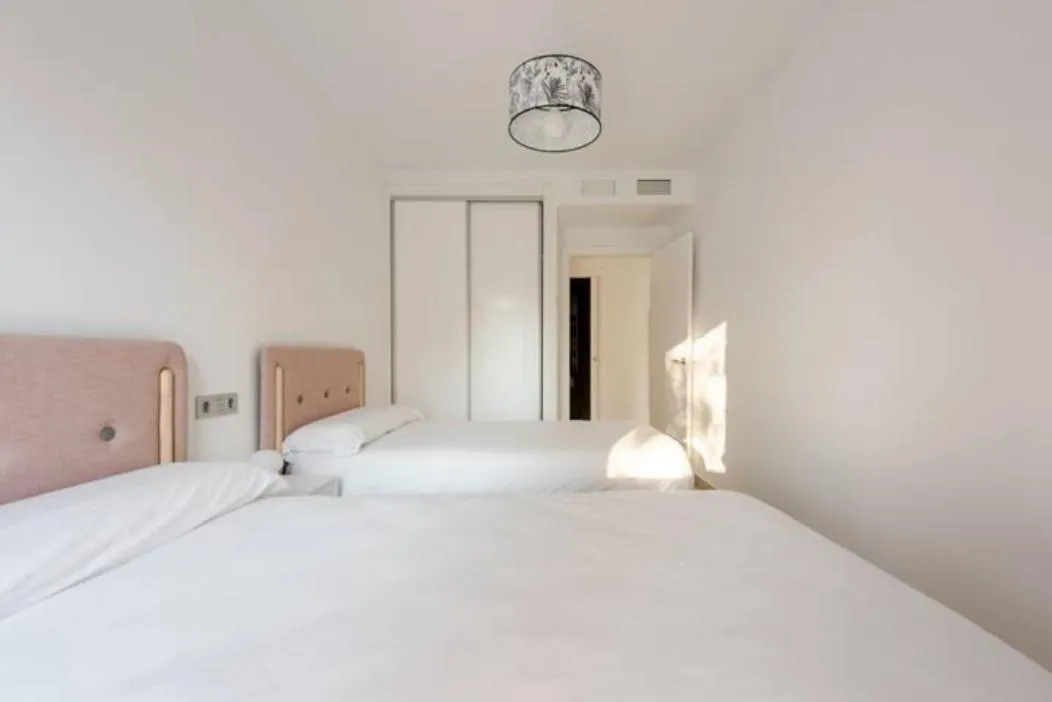 Bed in Carmela Suites Apartamento de dos dormitorios