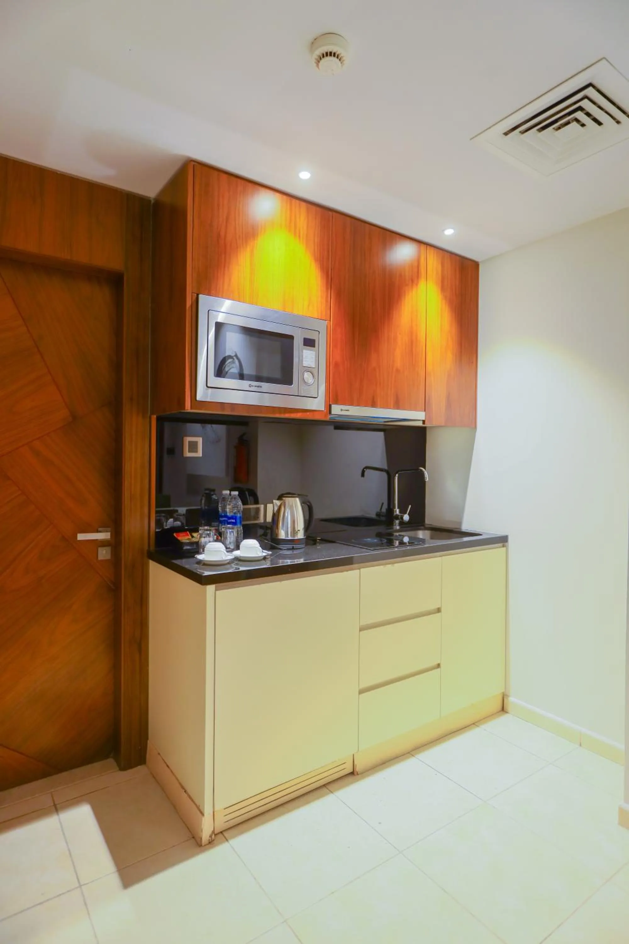 Kitchen or kitchenette in Ramee Palace Hotel