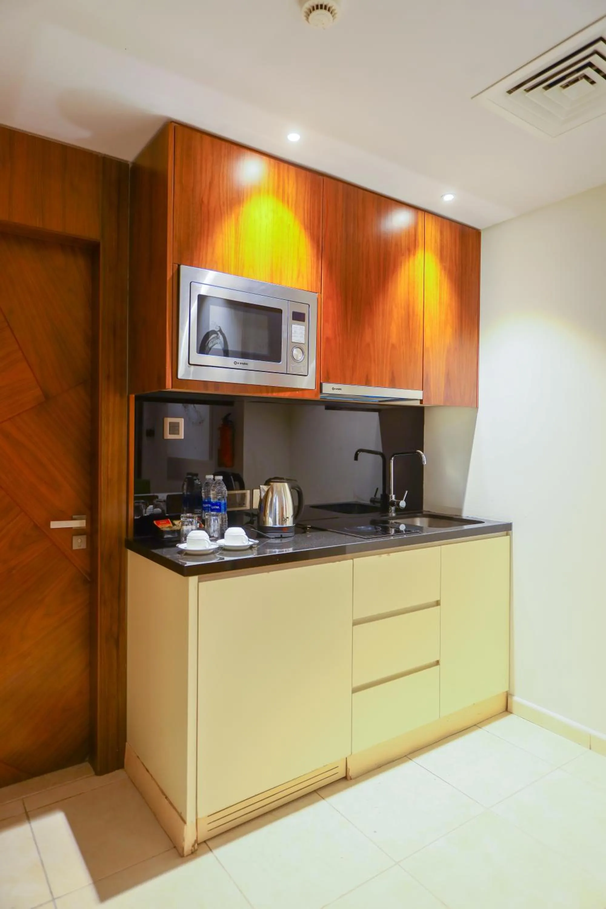 Kitchen or kitchenette in Ramee Palace Hotel