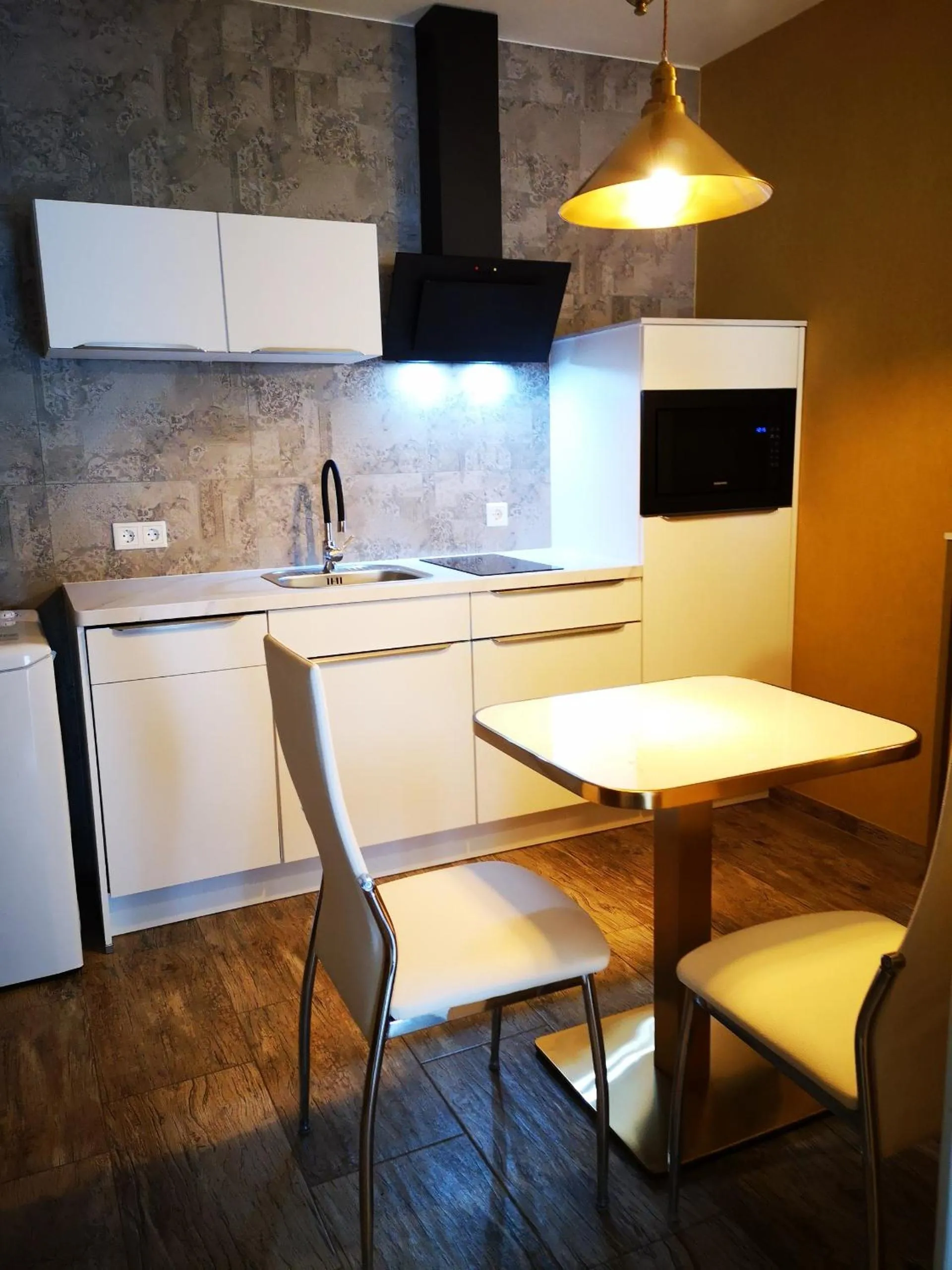 Kitchen or kitchenette in Aparthotel "Goldener Hahn Apartments"