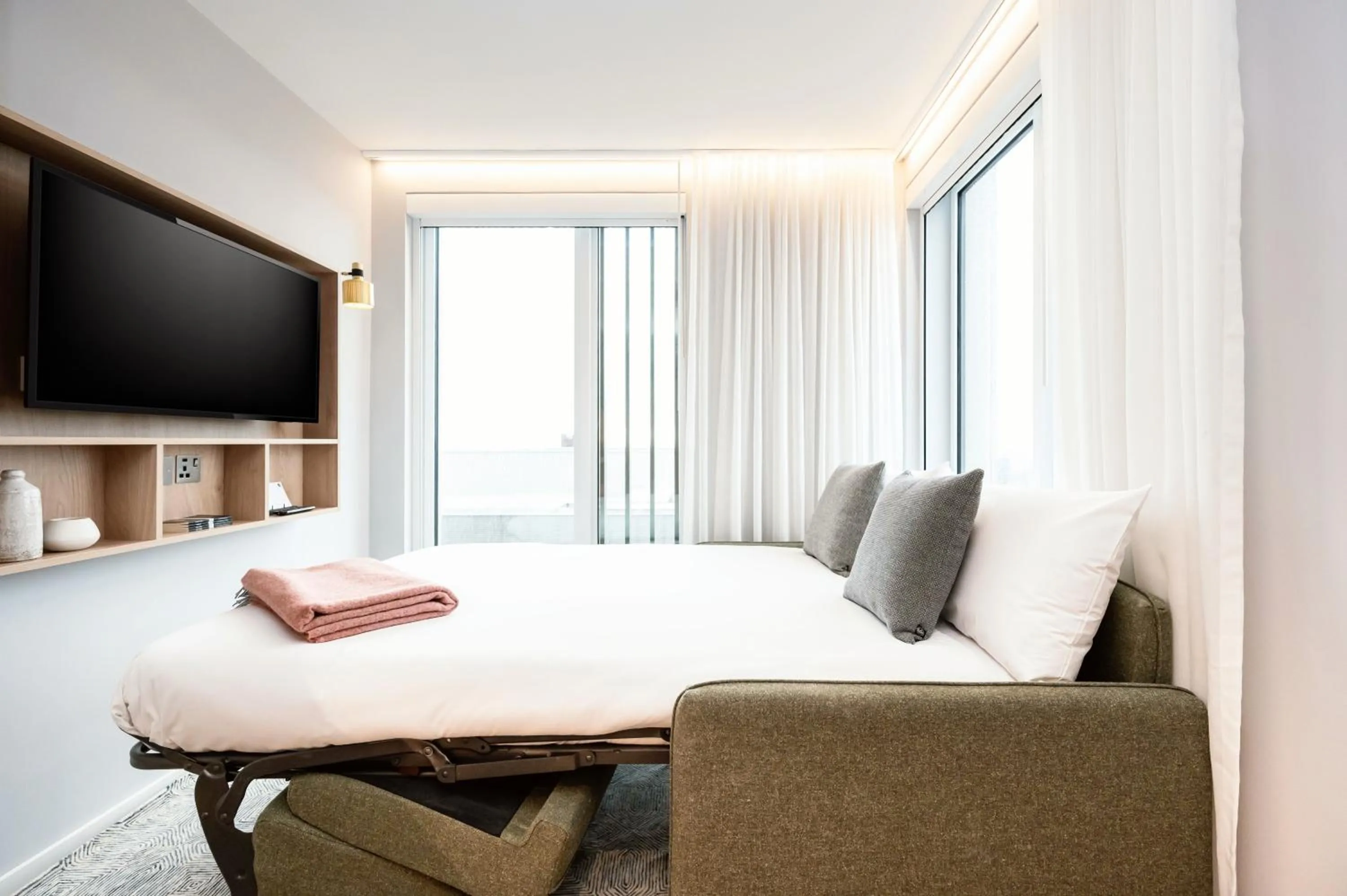 Living room, Bed in Wilde Aparthotels Manchester City Centre