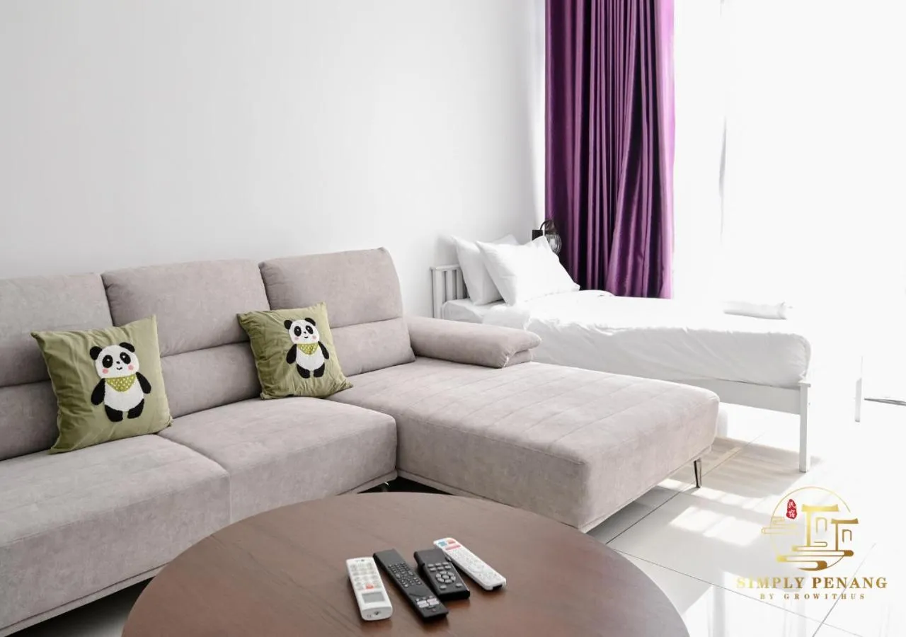 Living room, Bed in Beacon Executive Suites by Simply Penang