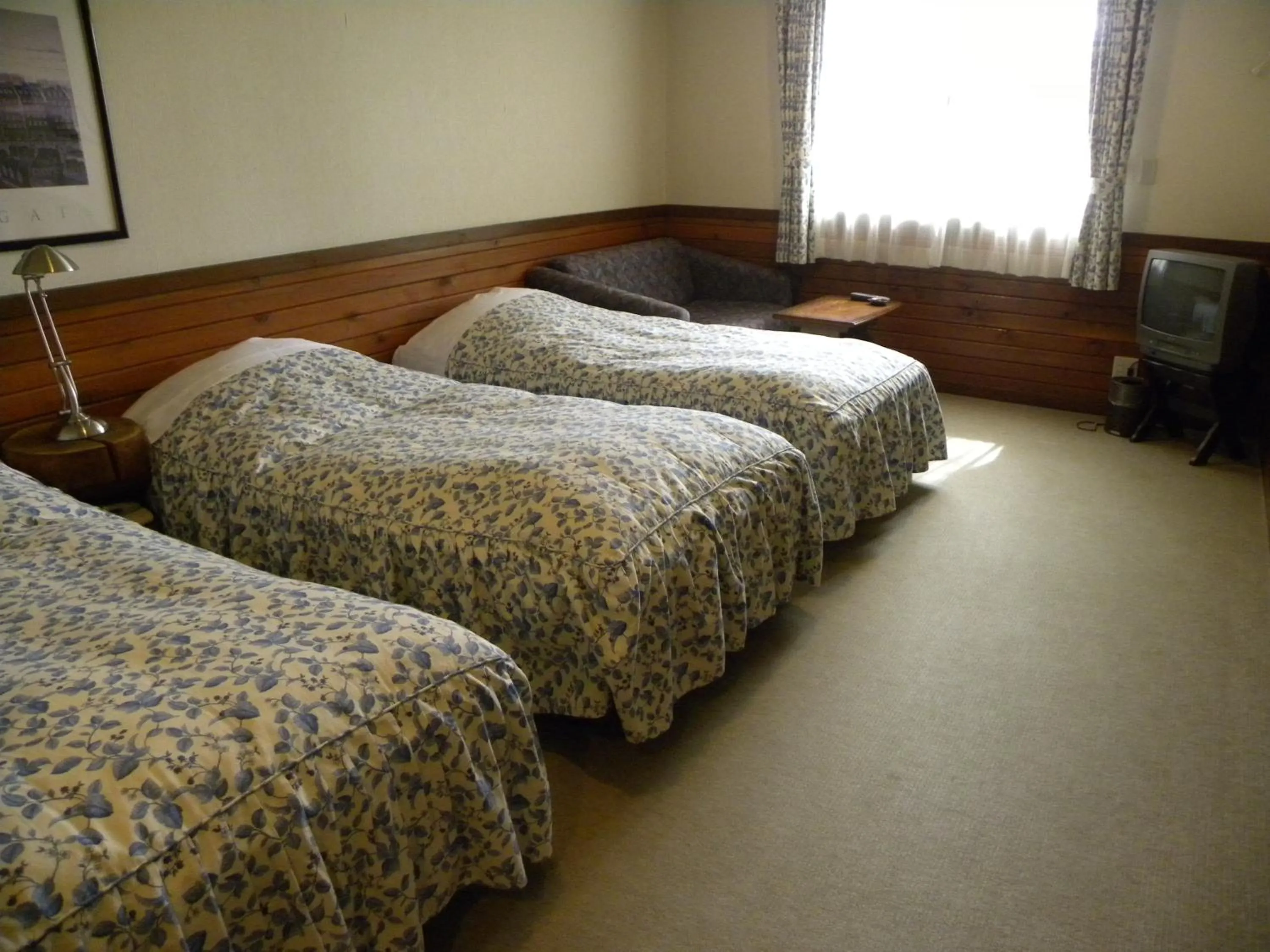 Bed in Petit Hotel Kazekozou