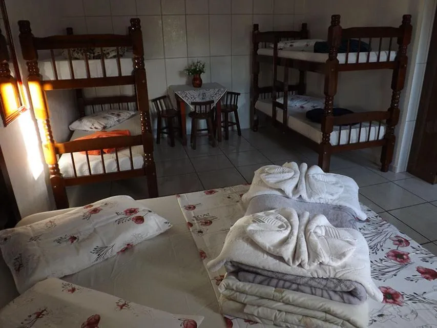 Bed in Pousada Anjo Gabriel