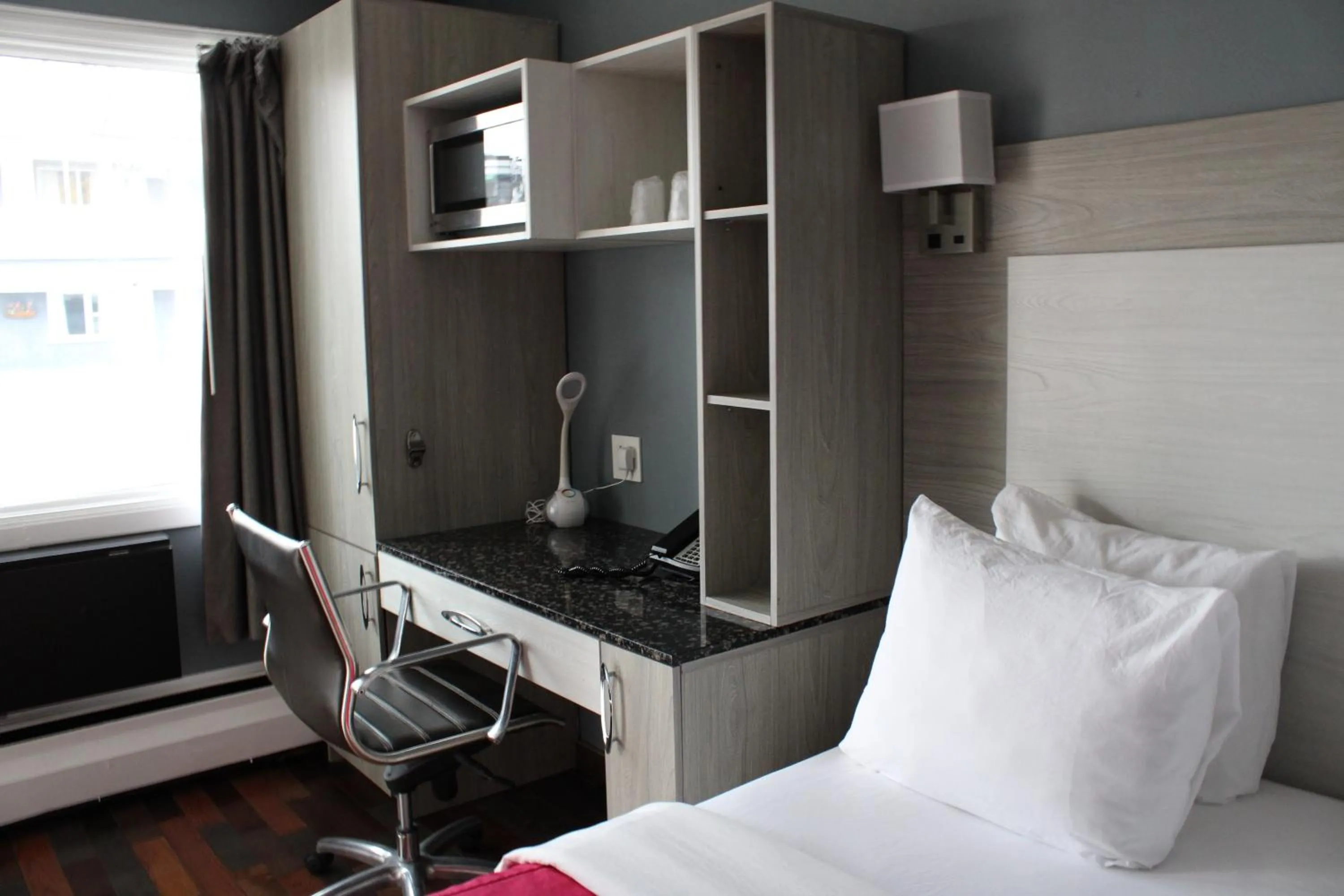 Bed in Olux Hotel-Motel-Suites