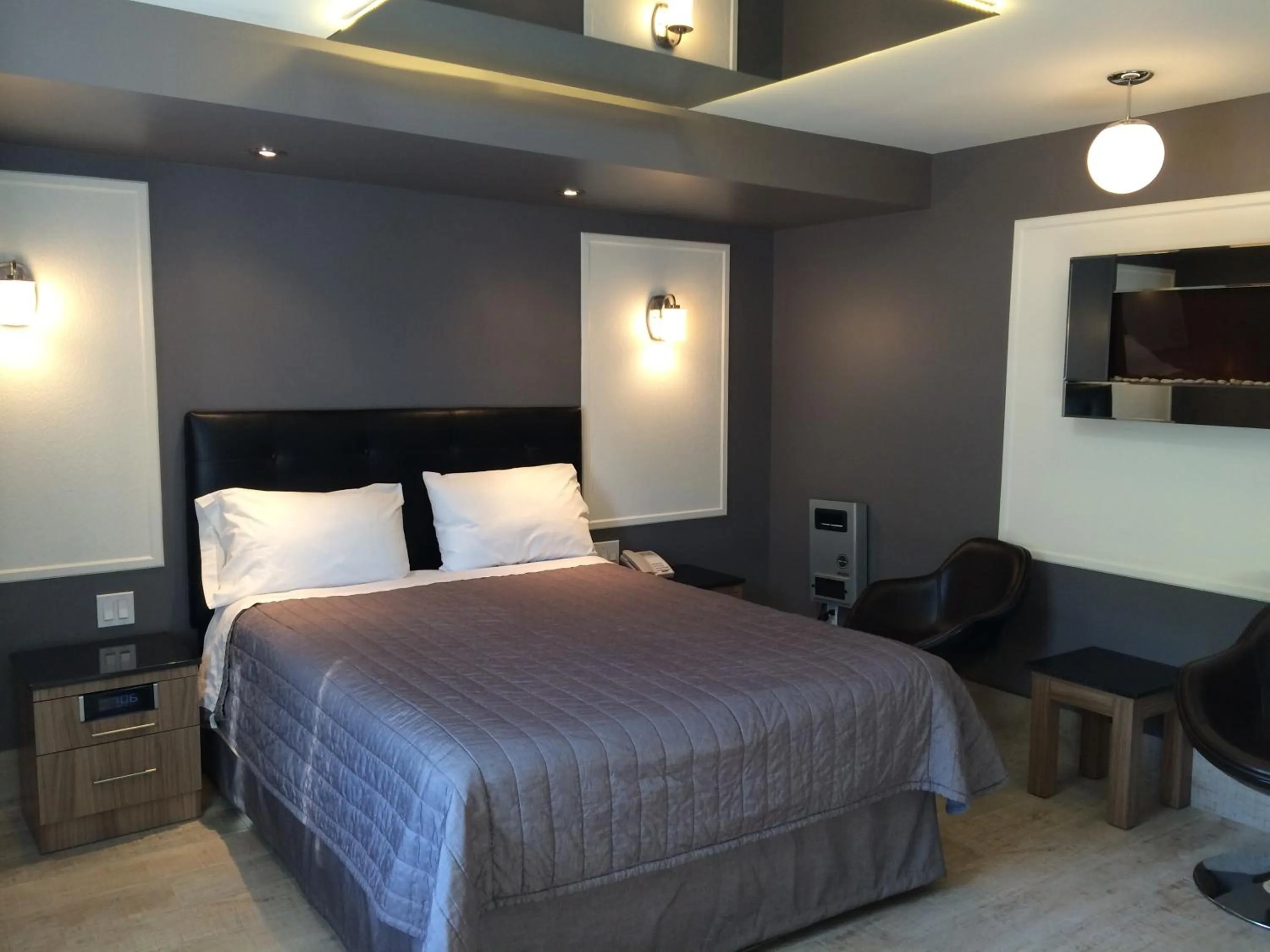 Bed in Olux Hotel-Motel-Suites