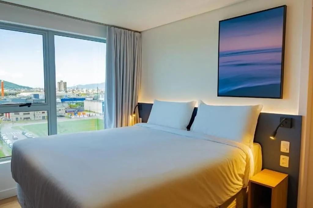 Bed in Atrium Studios by Xtay - Conforto em Palhoça, a poucos metros da praia