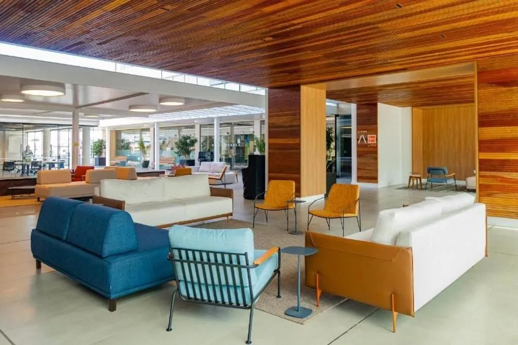 Lobby or reception in Atrium Studios by Xtay - Conforto em Palhoça, a poucos metros da praia