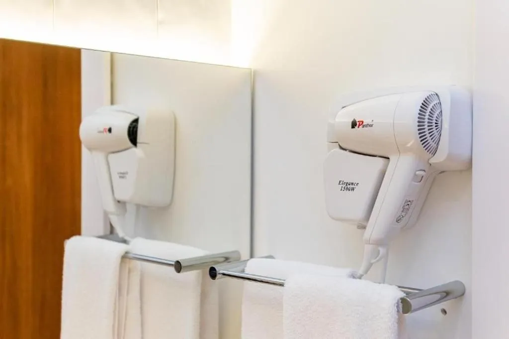 Toilet in Atrium Studios by Xtay - Conforto em Palhoça, a poucos metros da praia