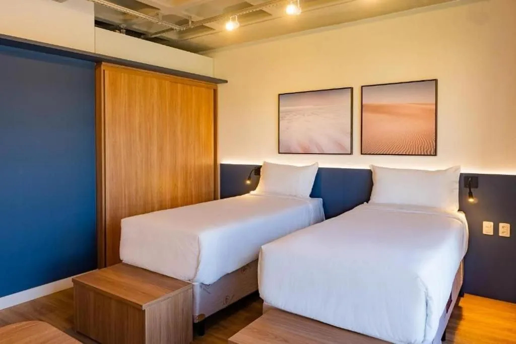 Bed in Atrium Studios by Xtay - Conforto em Palhoça, a poucos metros da praia