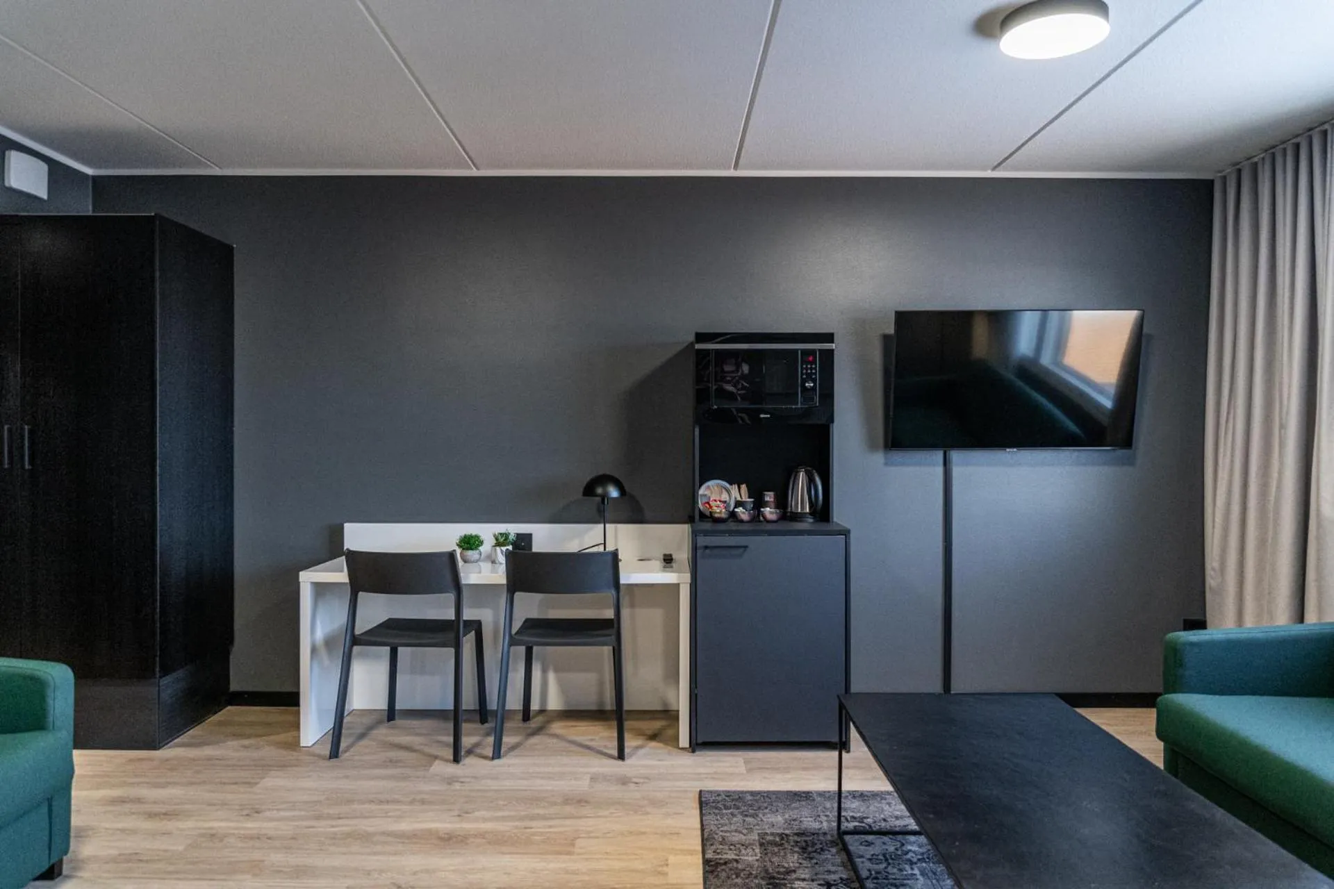 Living room in Hotelli Sointu by UHANDA