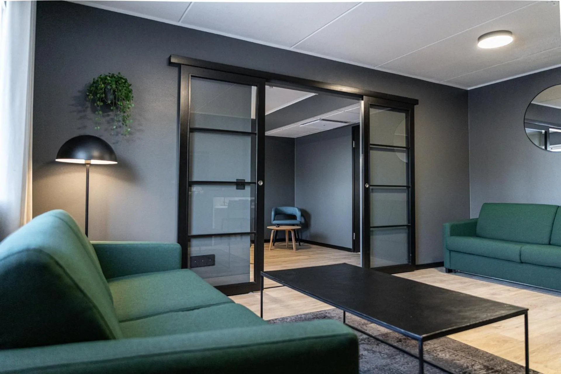 Living room in Hotelli Sointu by UHANDA