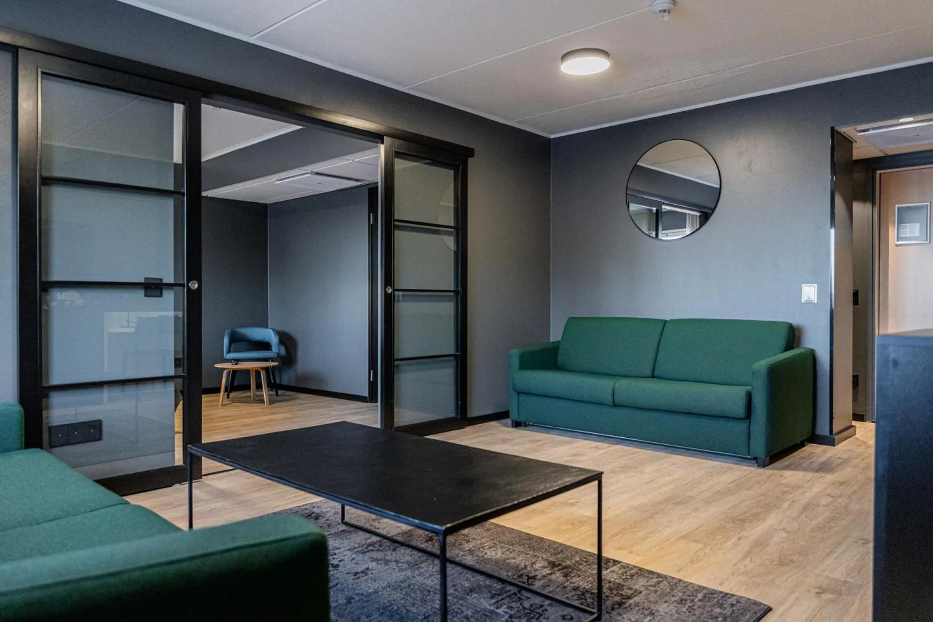 Living room in Hotelli Sointu by UHANDA