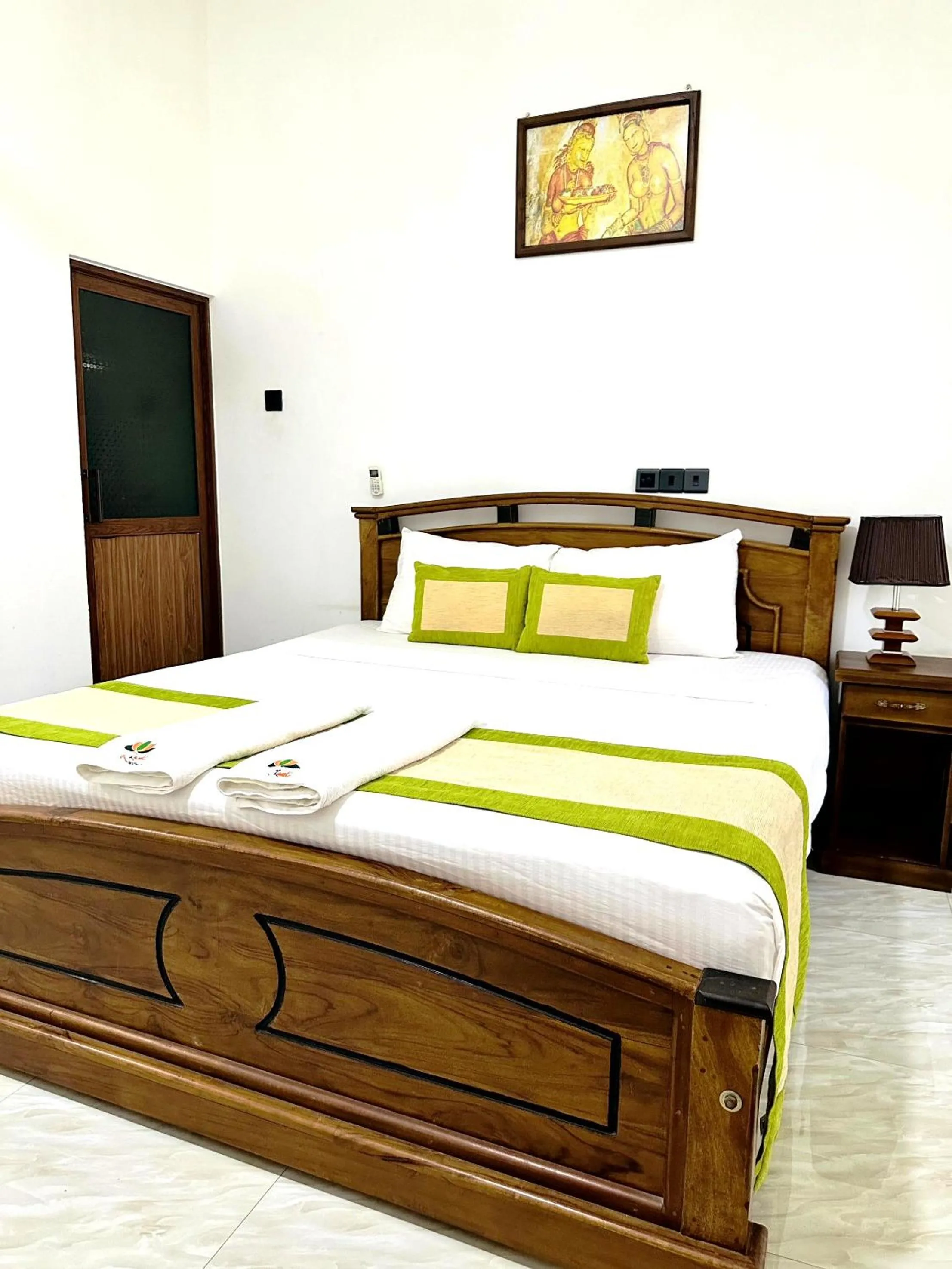 Bed in L S Lanka Hotel Dambulla