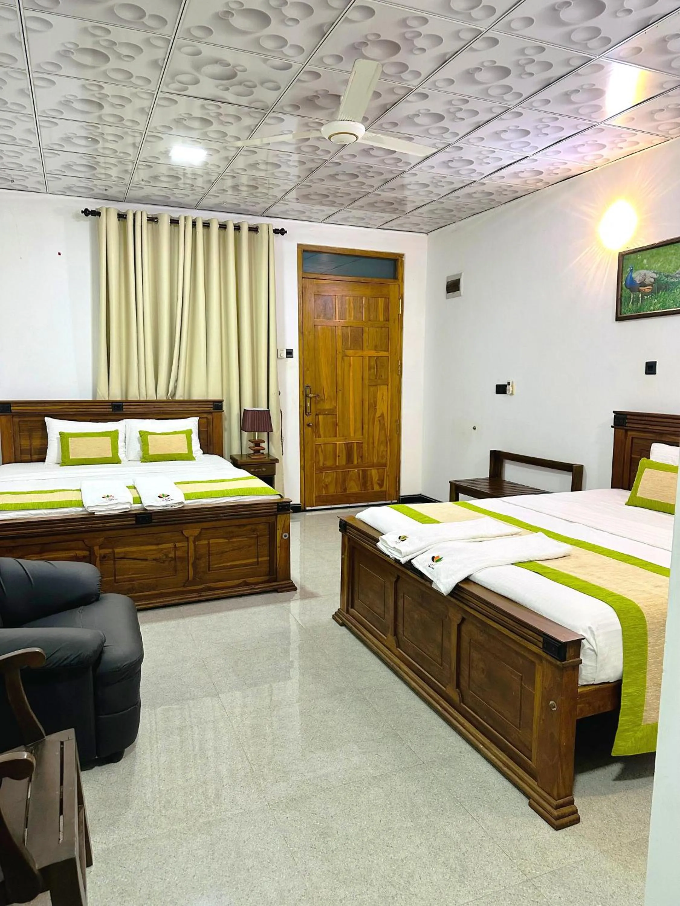 Bed in L S Lanka Hotel Dambulla