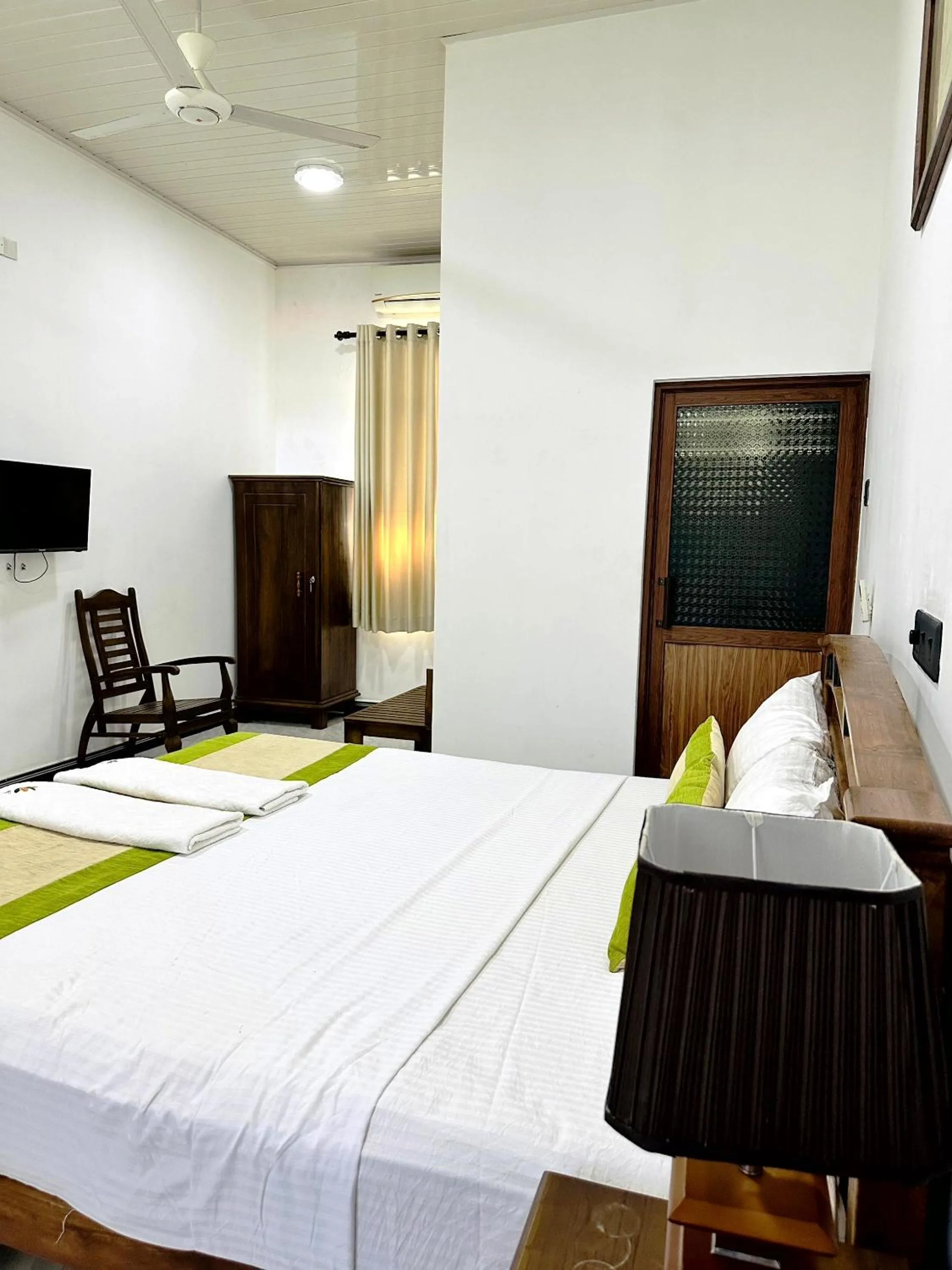 Bed in L S Lanka Hotel Dambulla