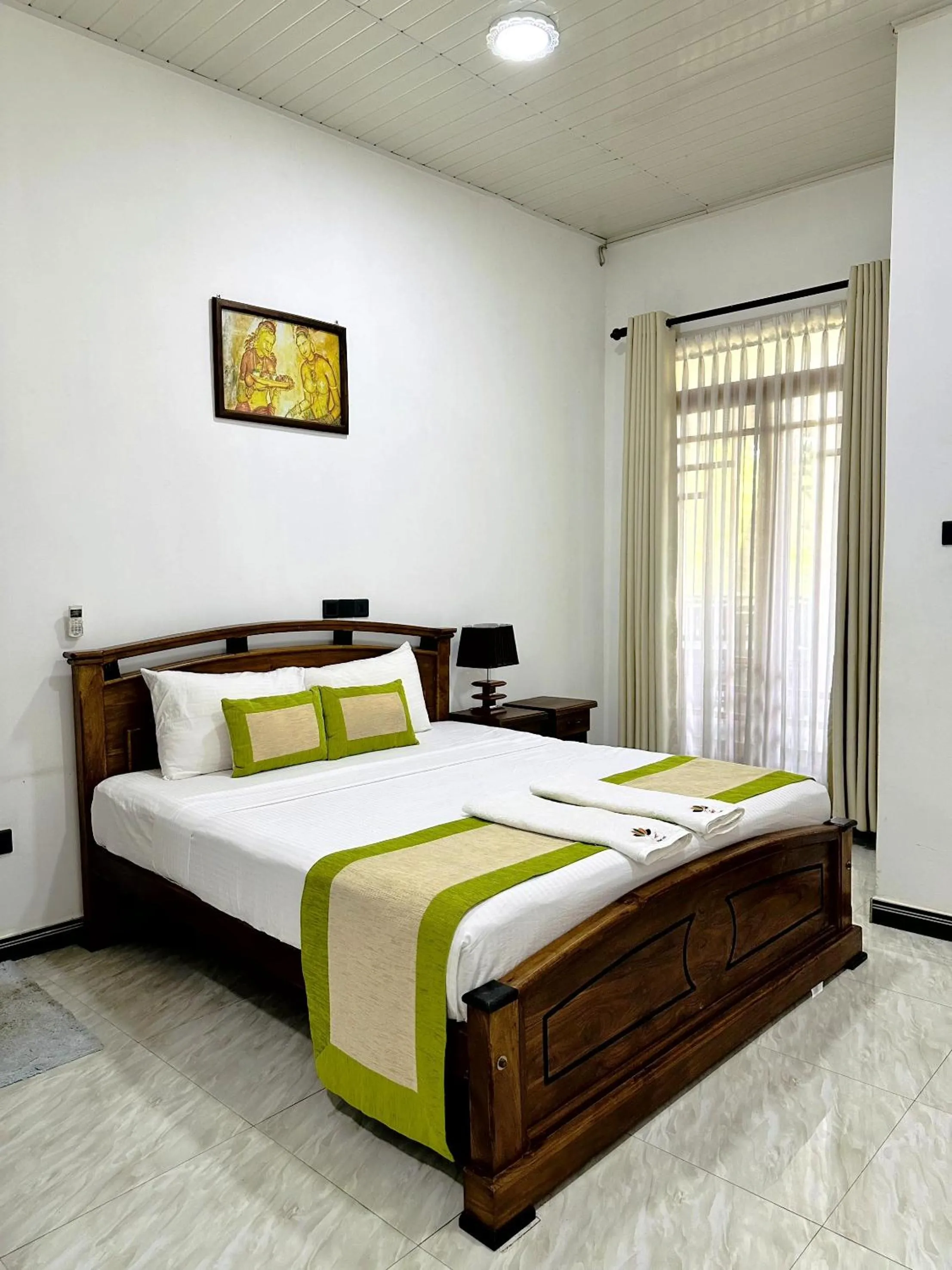 Bed in L S Lanka Hotel Dambulla