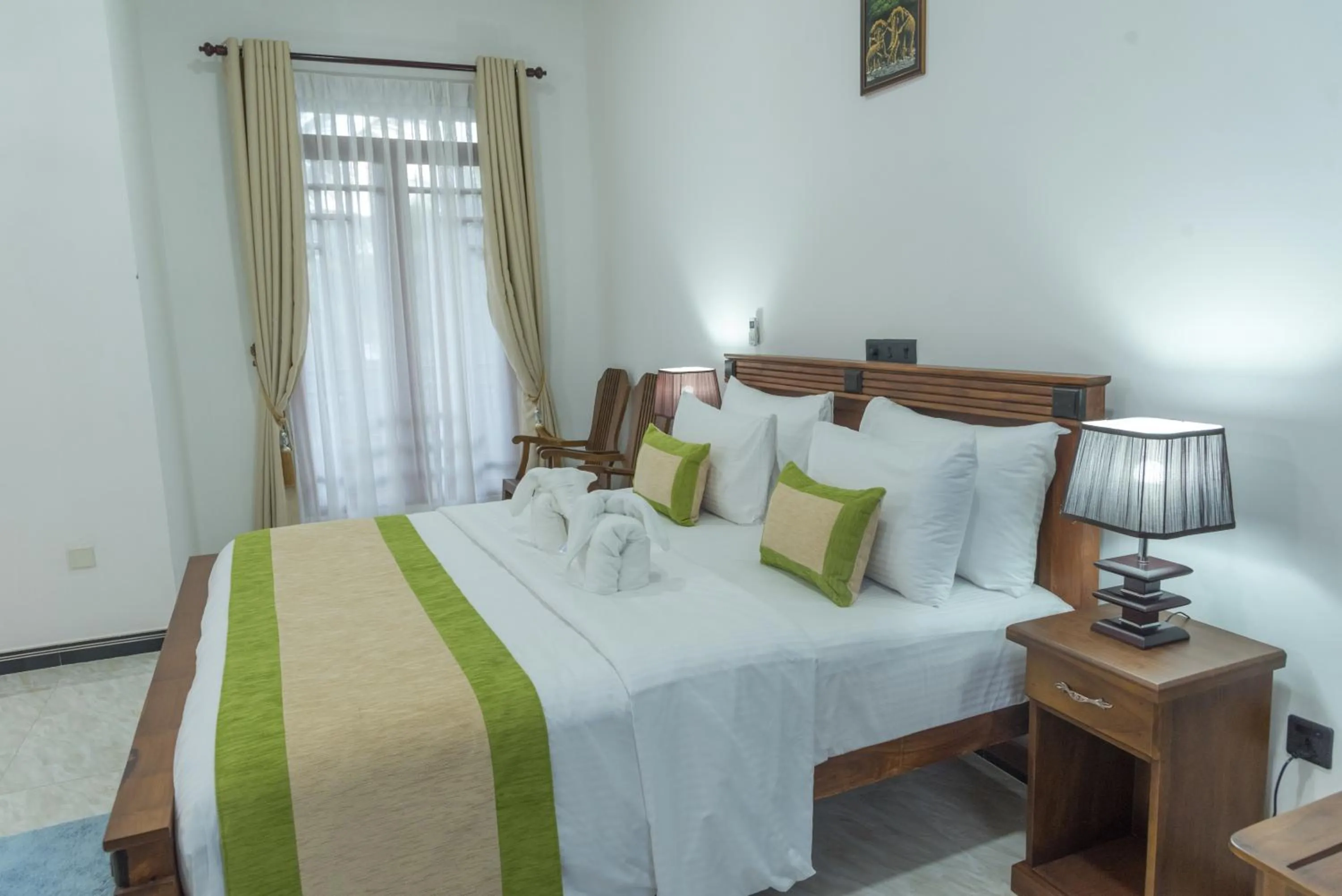 Bed in L S Lanka Hotel Dambulla