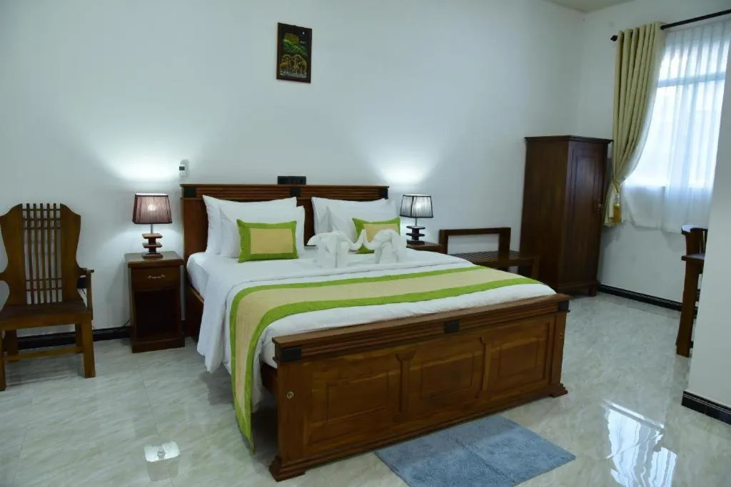 Bed in L S Lanka Hotel Dambulla