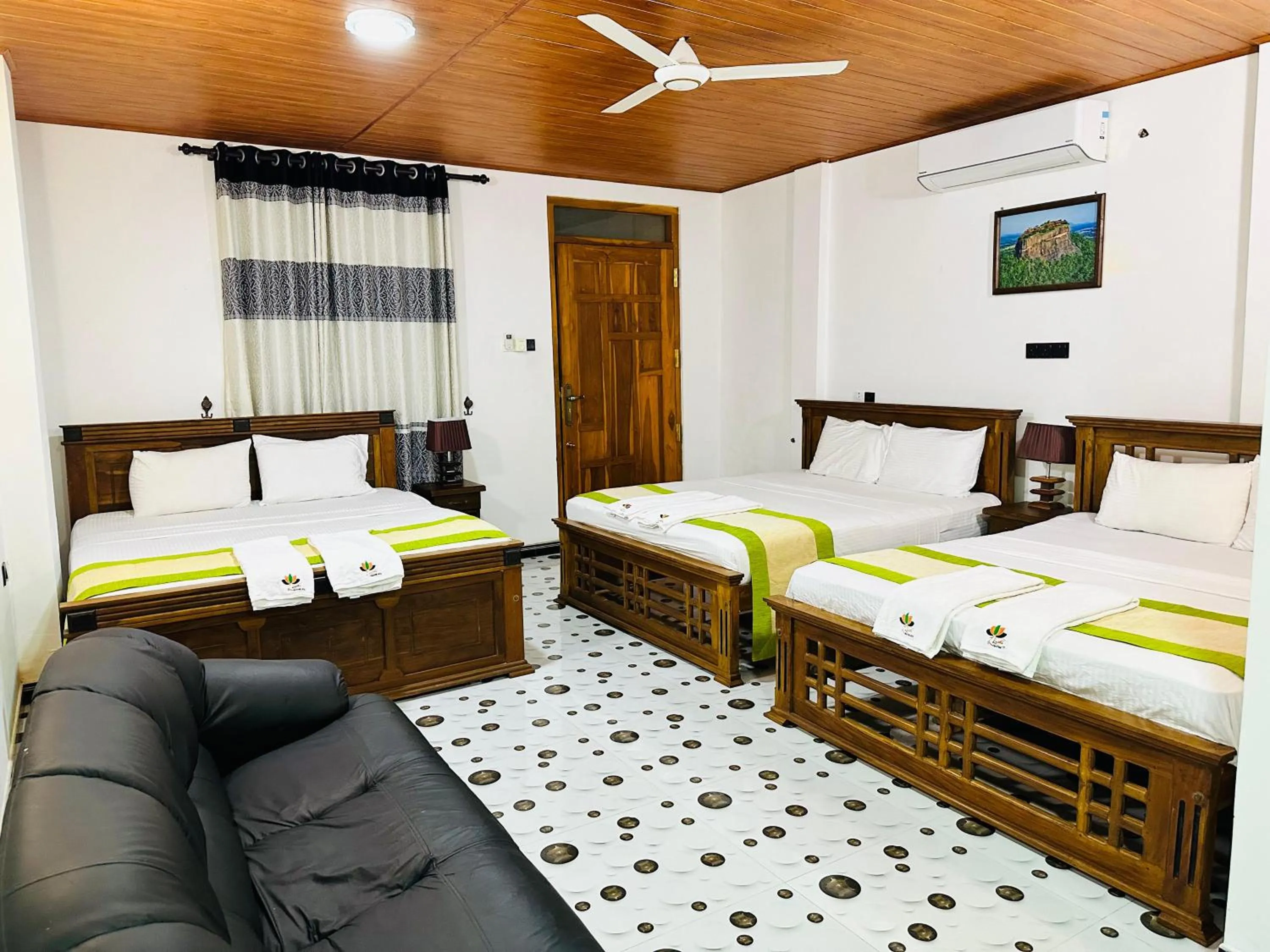 Bed in L S Lanka Hotel Dambulla