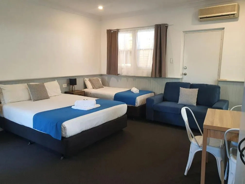 Photo of the whole room, Bed in Squid's Ink Motel