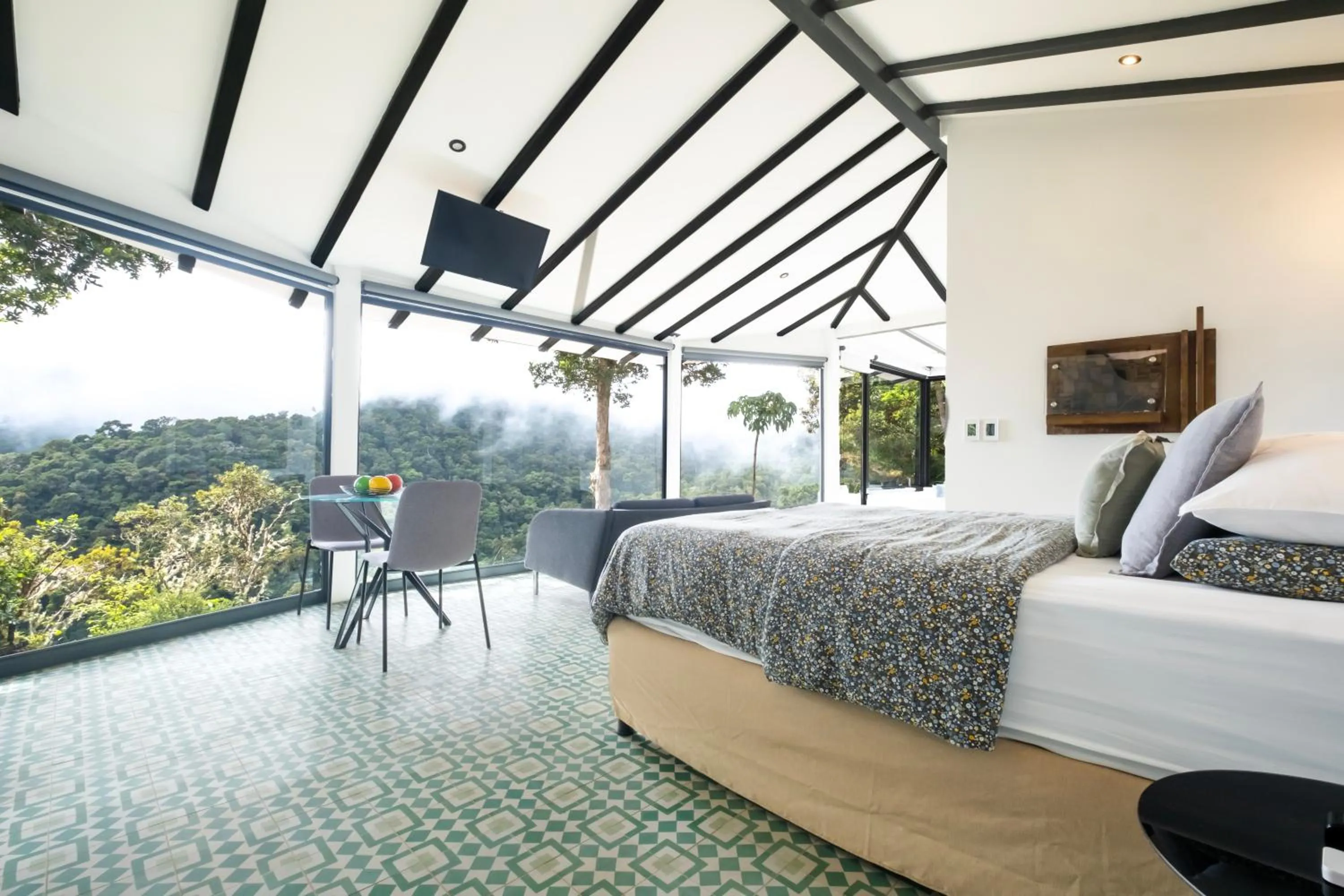 Bed in Dantica Cloud Forest Lodge